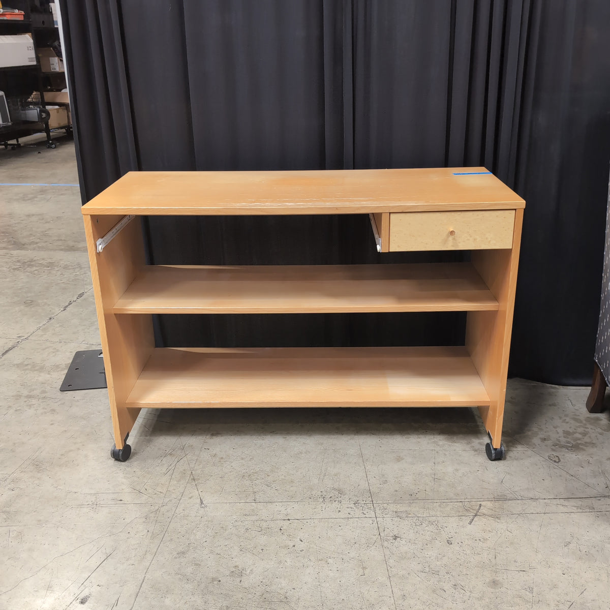 Light Wood Three-Shelf Bookcase with Casters