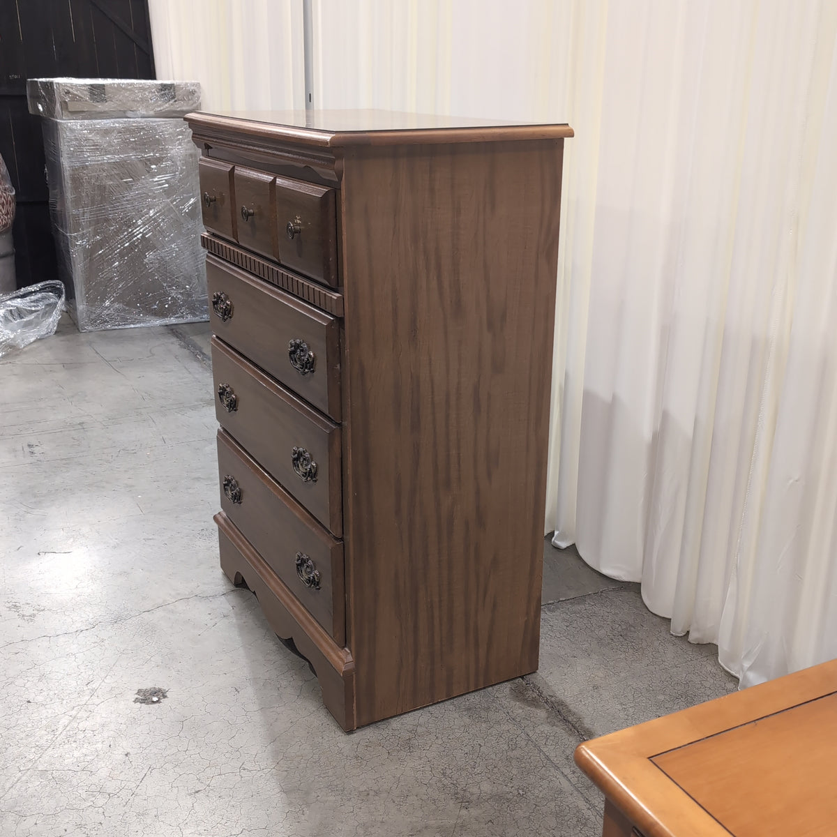 Traditional Warm Wood Five-Drawer Dresser with Ornate Hardware