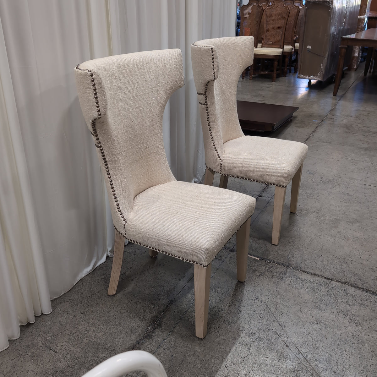 Light Beige Upholstered High-Back Chair with Nailhead Trim