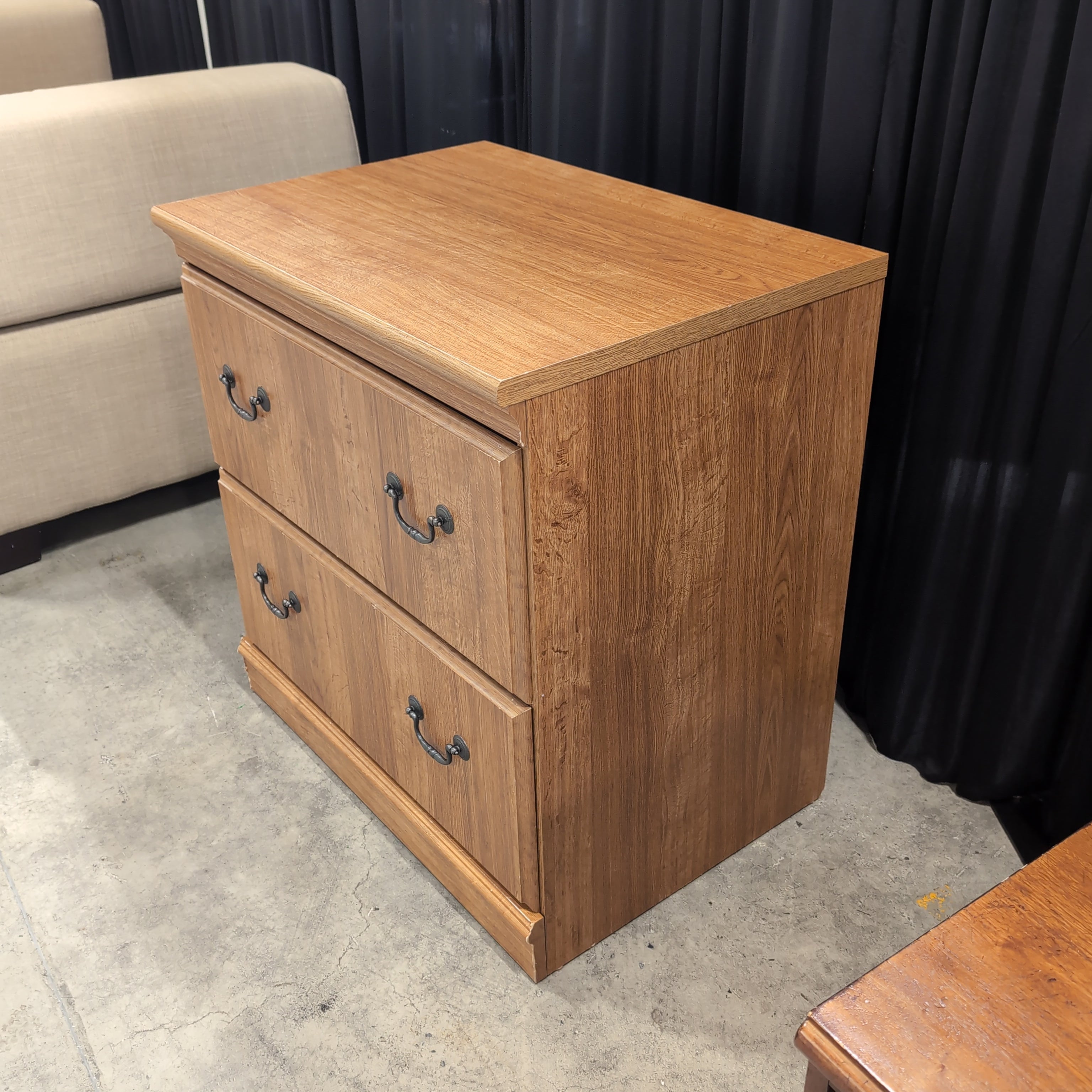 Brown Wood Three-Drawer Dresser with Dark Metal Pulls