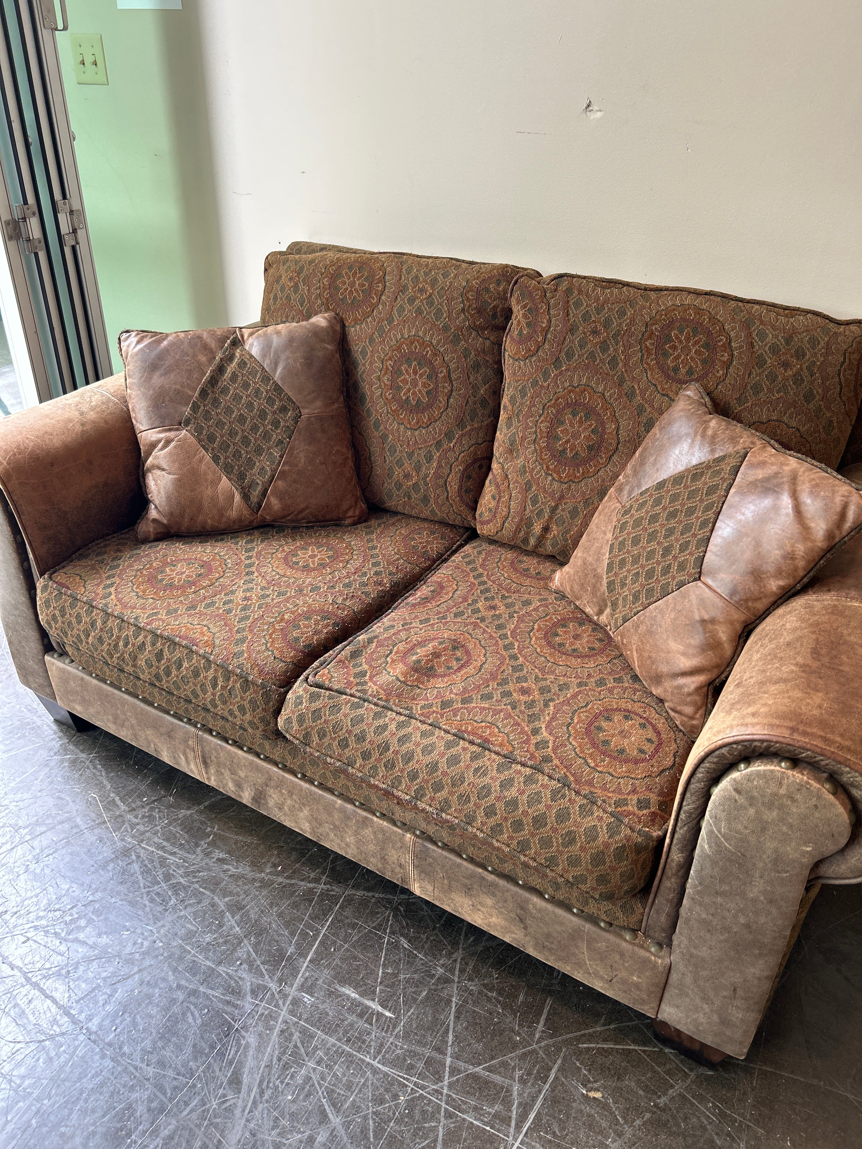 Brown and Rust Pattern Loveseat with Leather Accent