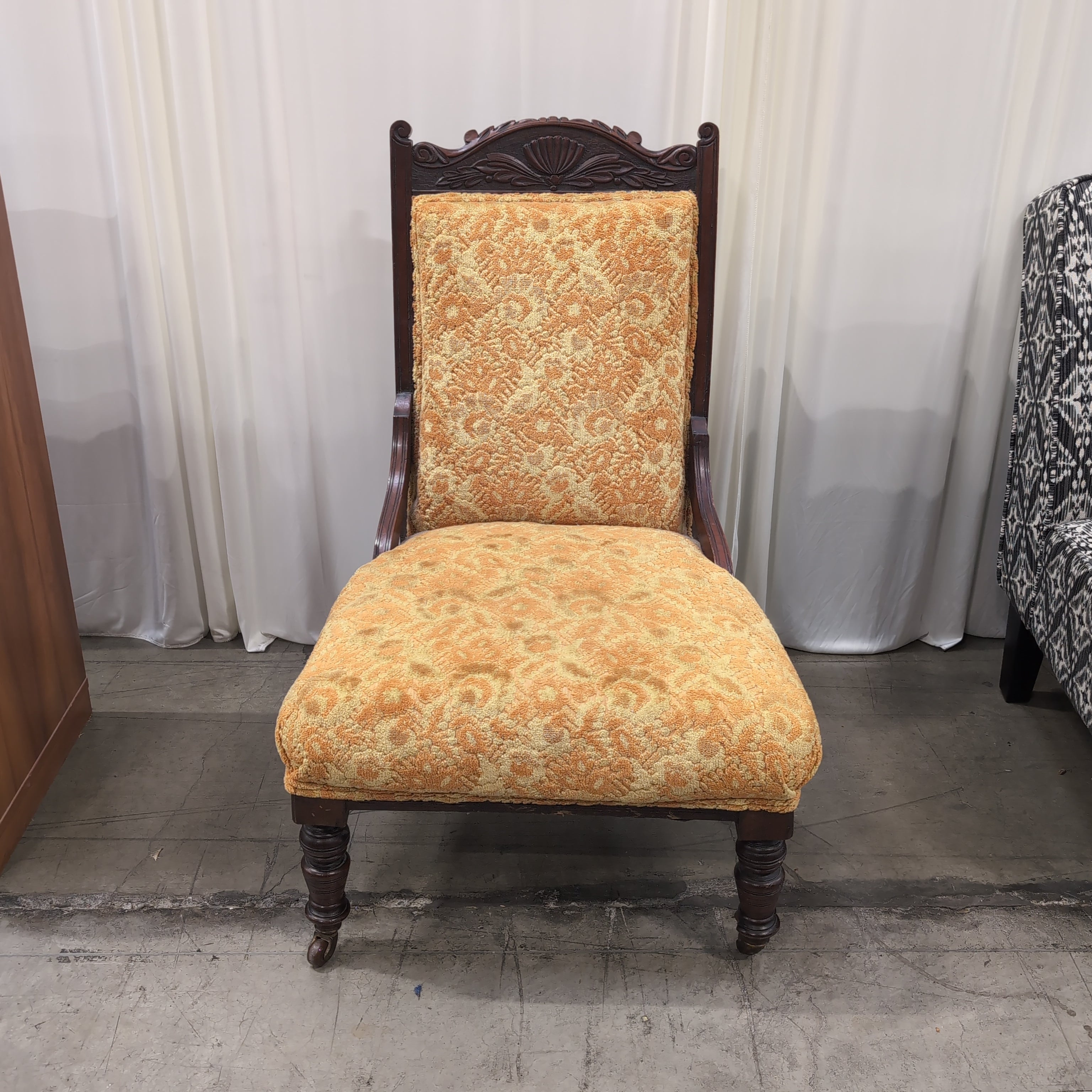 Carved Dark Wood Accent Chair with Patterned Upholstery