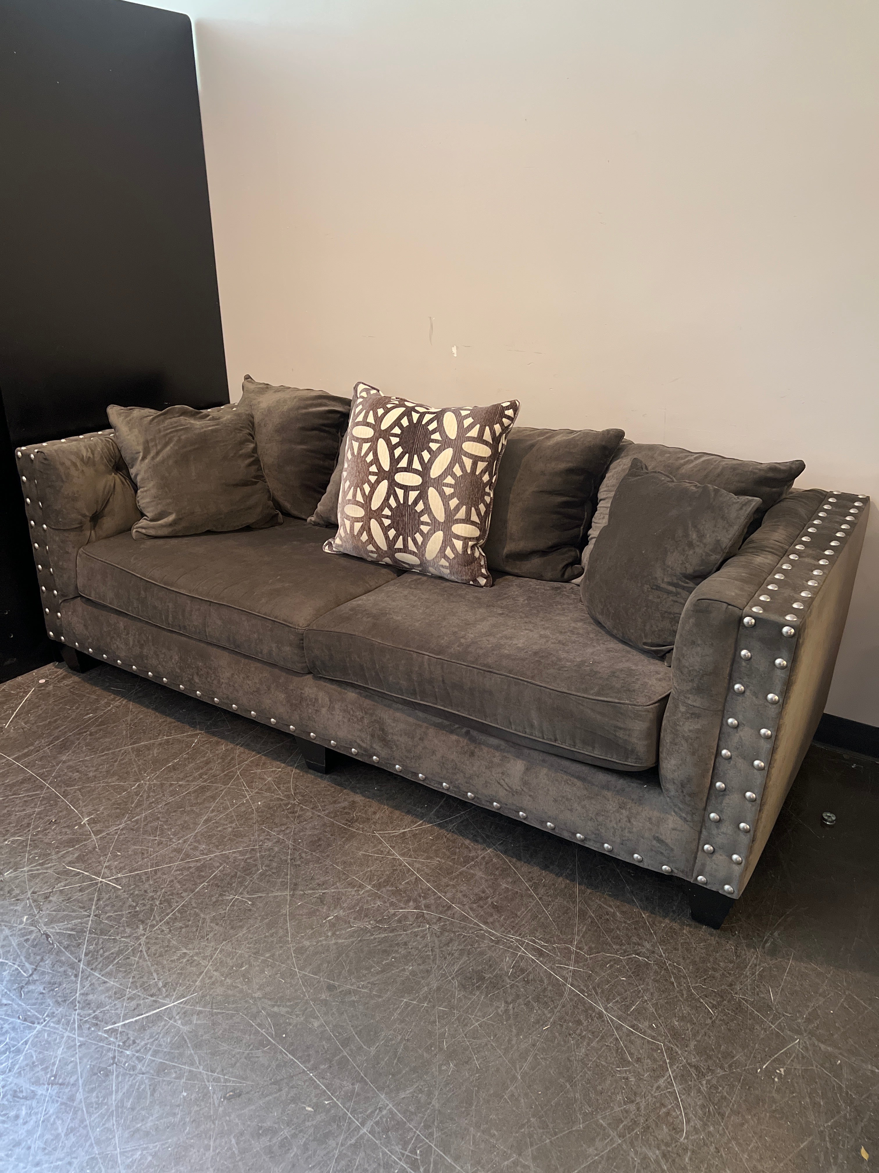 Dark Brown Tufted Sofa with Metal Accents