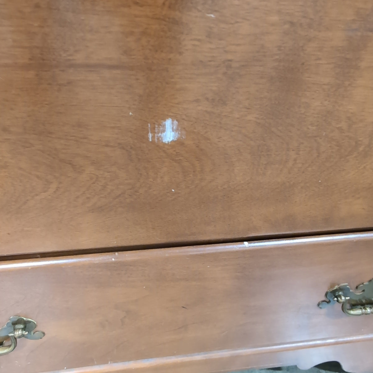 Brown Wood Nine-Drawer Dresser with Ornate Hardware
