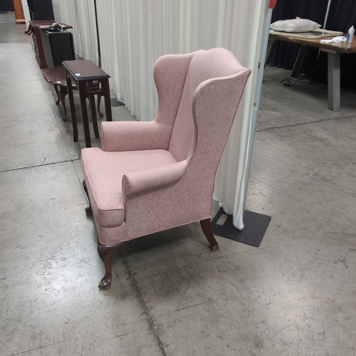 Mauve Upholstered Wingback Chair with Geometric Pattern