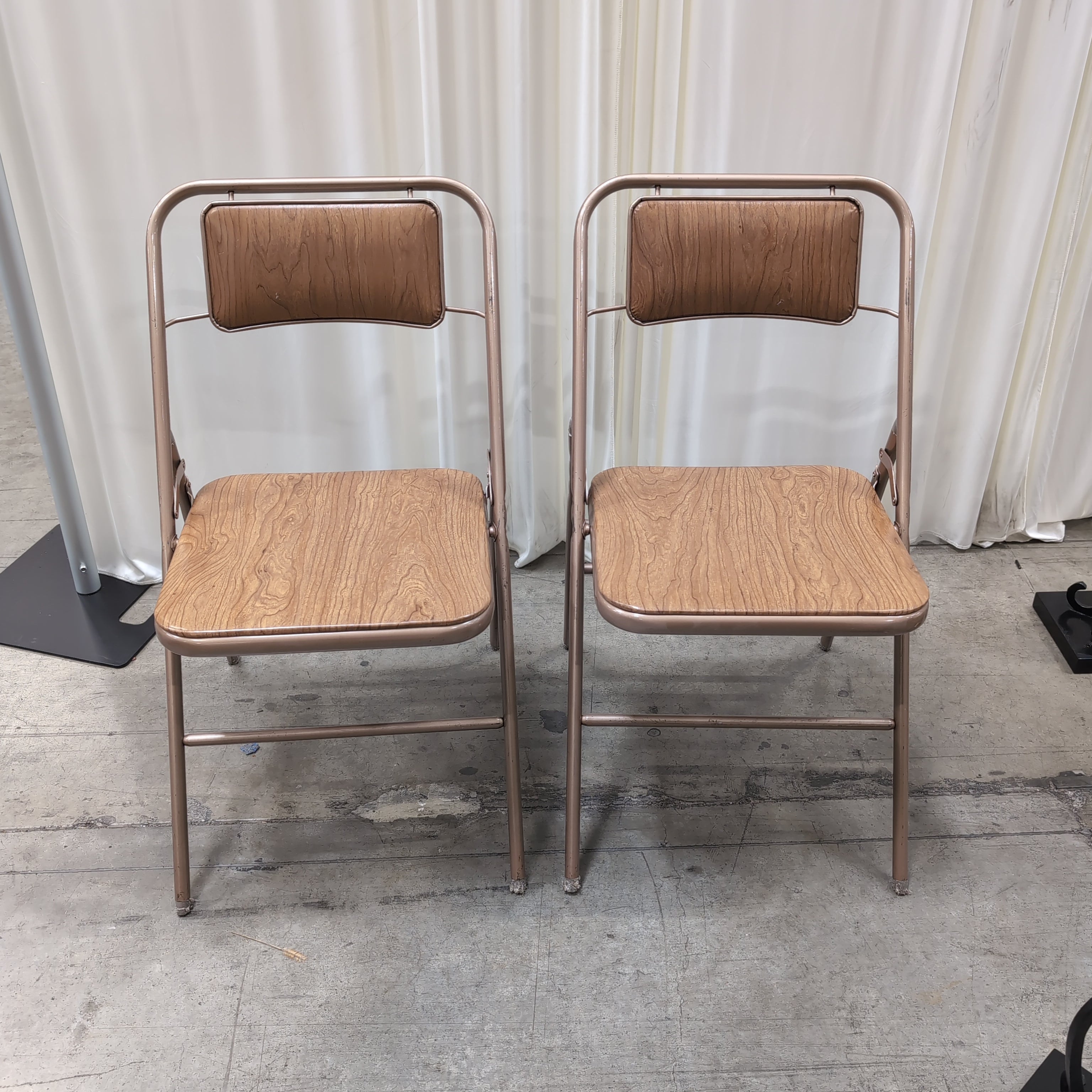 Pair of Bronze Metal Folding Chairs with Wood-Look Seats