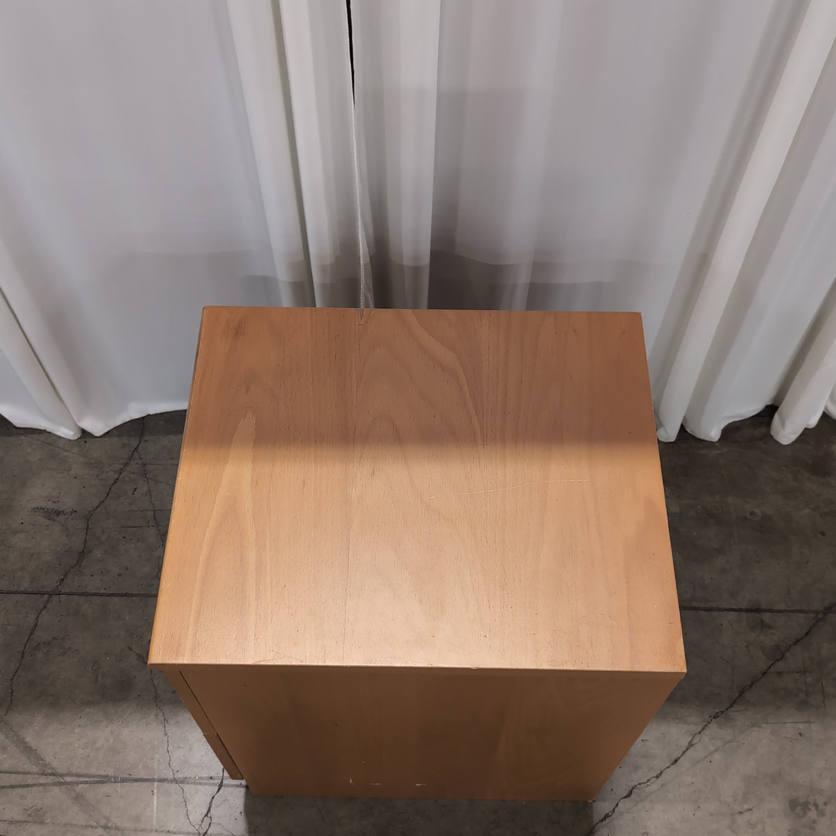 Light Wood Two-Drawer Nightstand with Silver Knobs