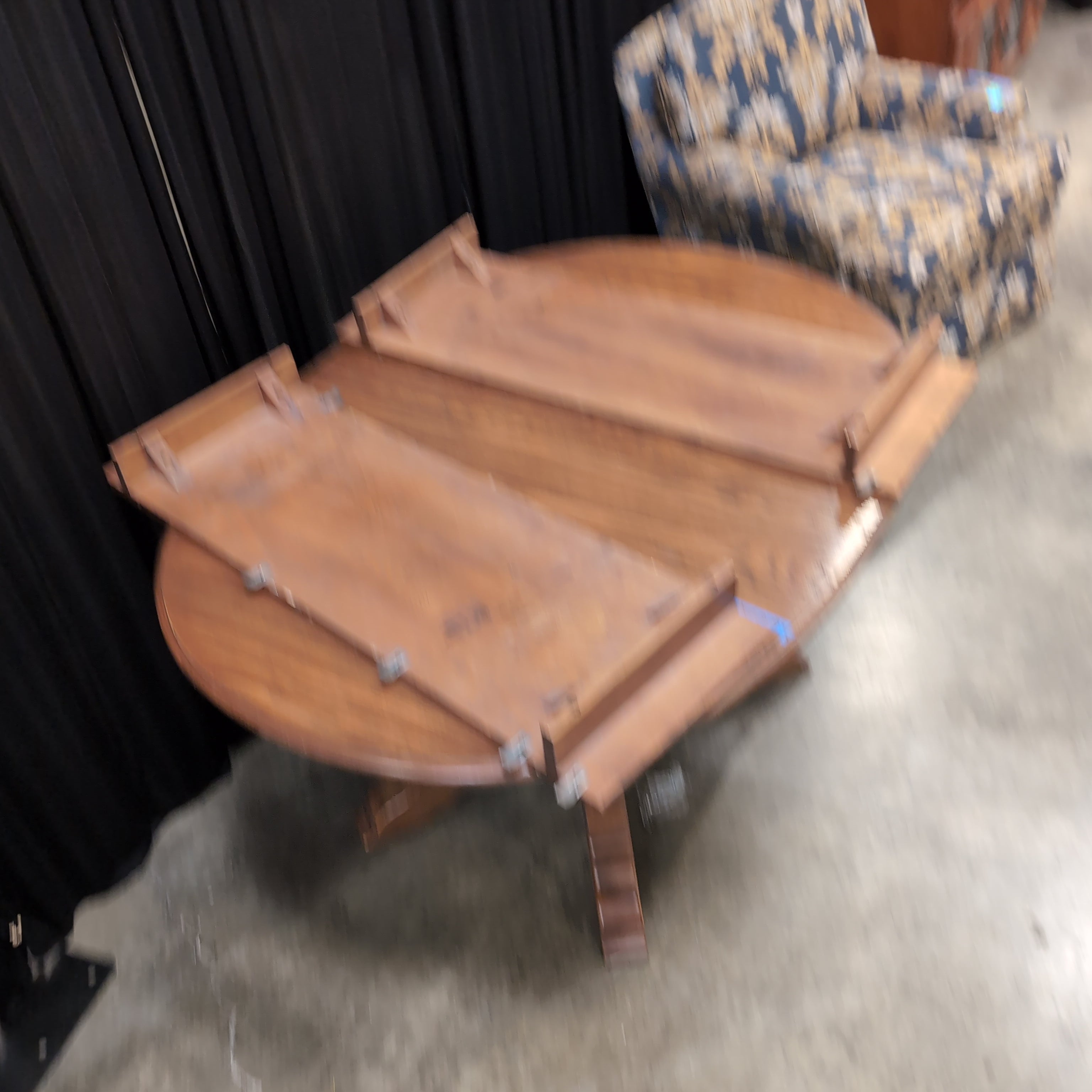 Round Brown Wood Dining Table with Drop Leaves