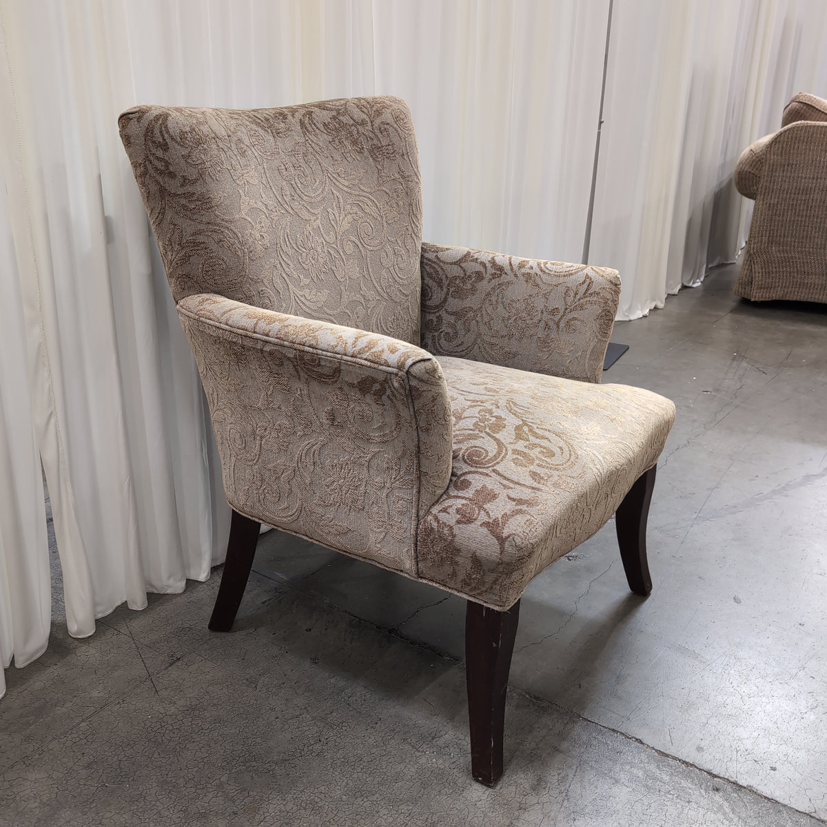 Beige Damask Upholstered Wingback Armchair with Dark Wood Legs