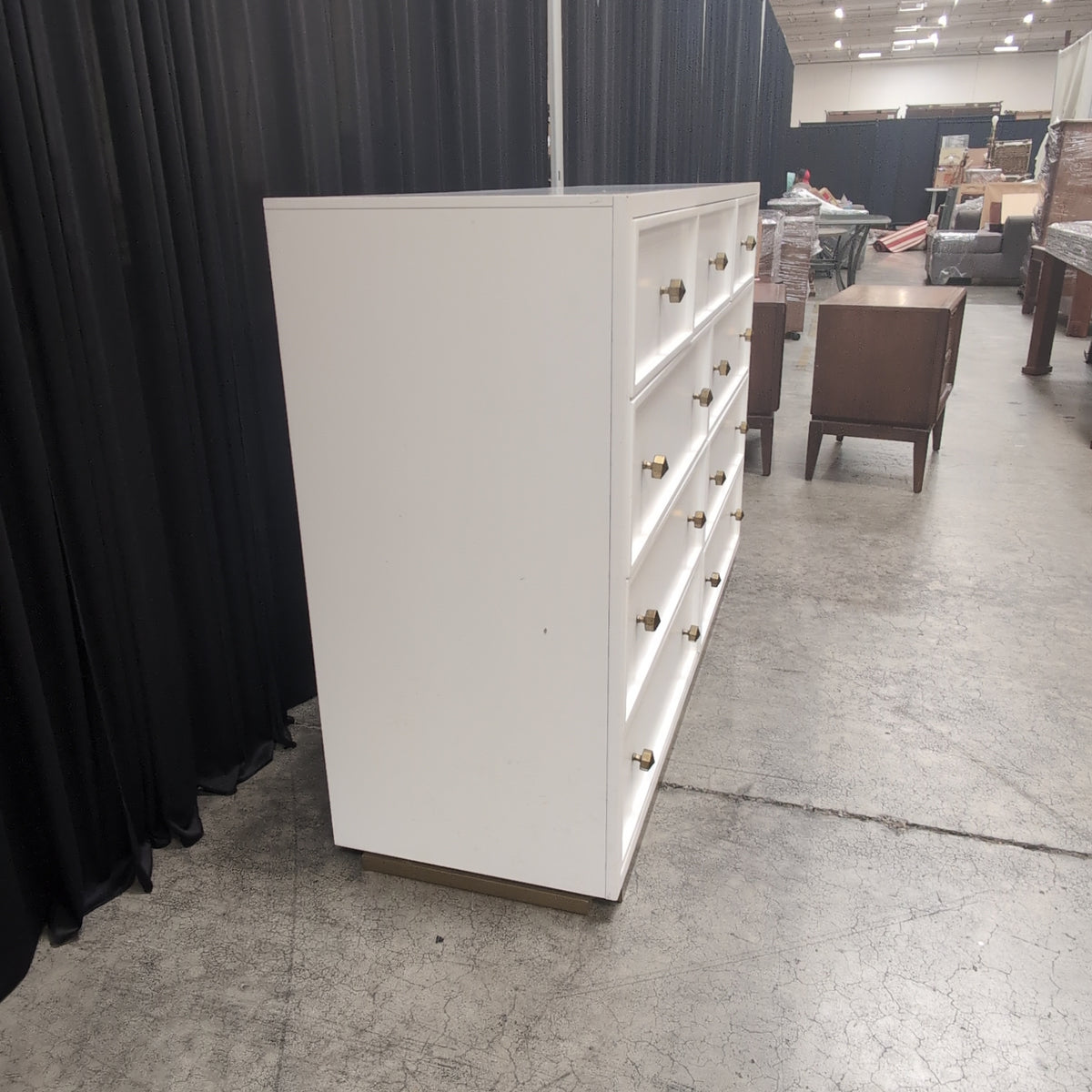 Clean-Lined White Nine-Drawer Dresser with Brass Knobs