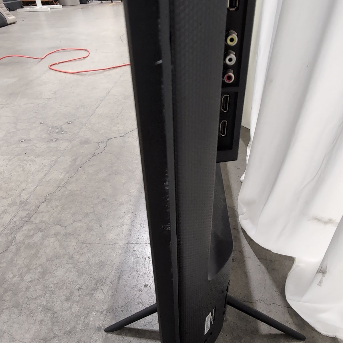 Large Black Flat Screen TV with Stand