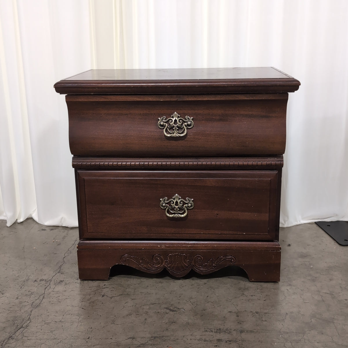 Traditional Dark Wood Two-Drawer Nightstand with Ornate Hardware