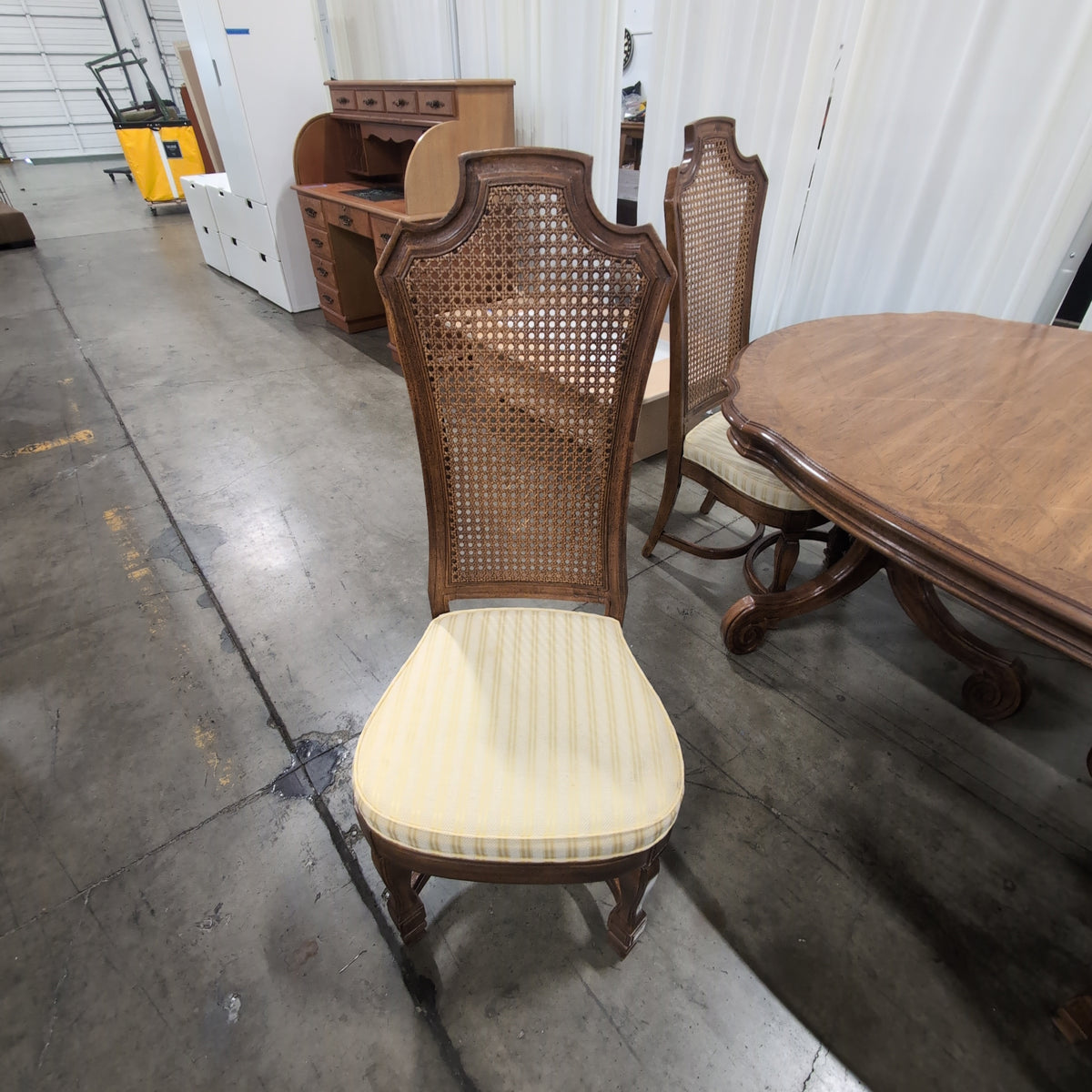 Ornate Brown Wood Dining Table With Six Cane Back Chairs