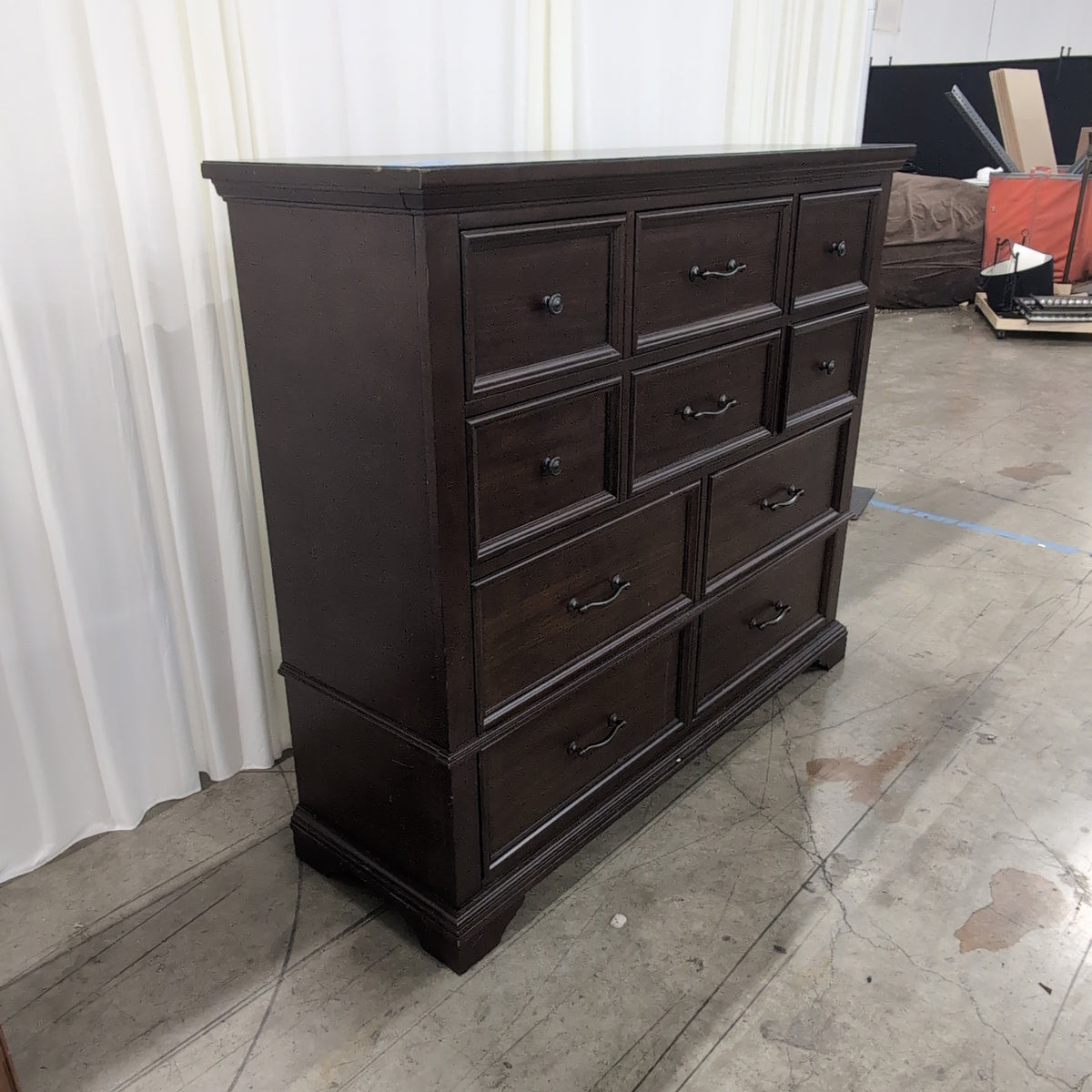 Dark Brown Wood Eight-Drawer Dresser with Ornate Hardware