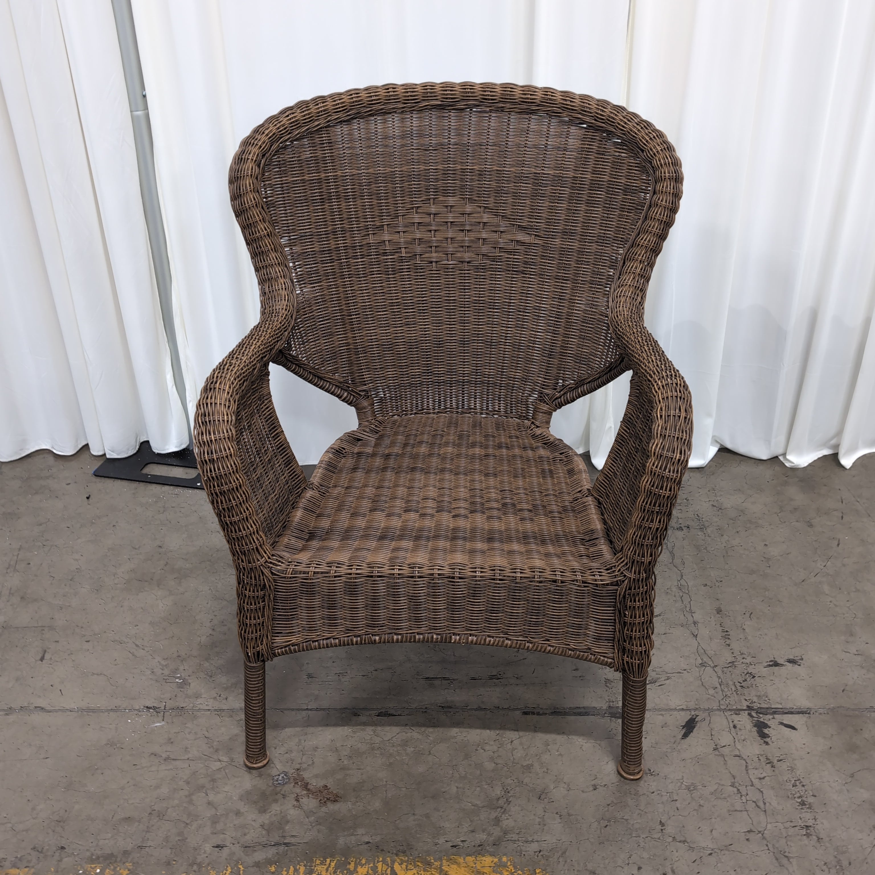 Brown Wicker Accent Chair with Green Cushion