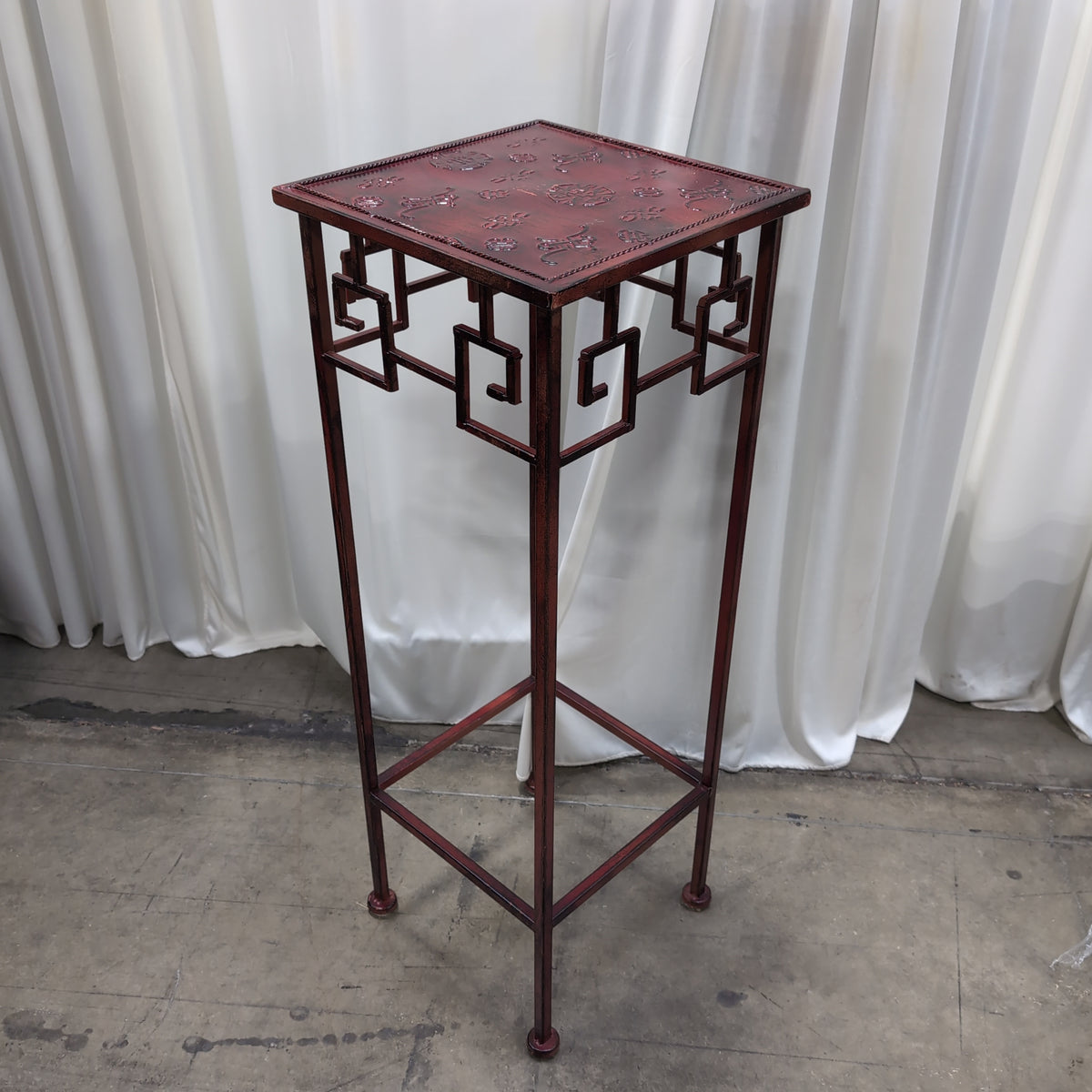 Burgundy Metal Display Stand with Patterned Top