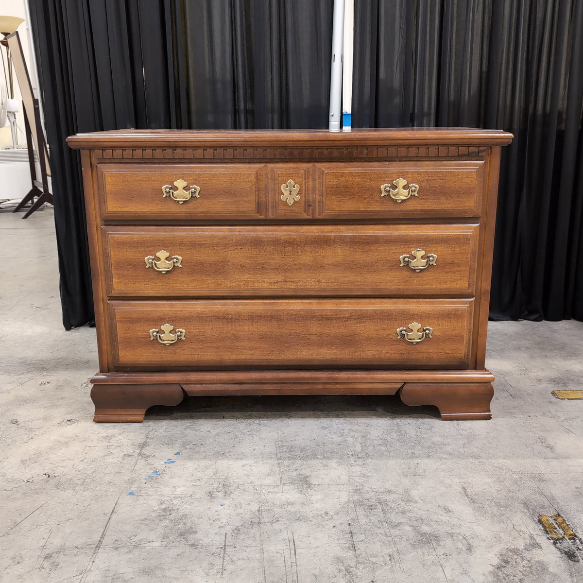 Traditional Brown Wood Dresser with Ornate Hardware