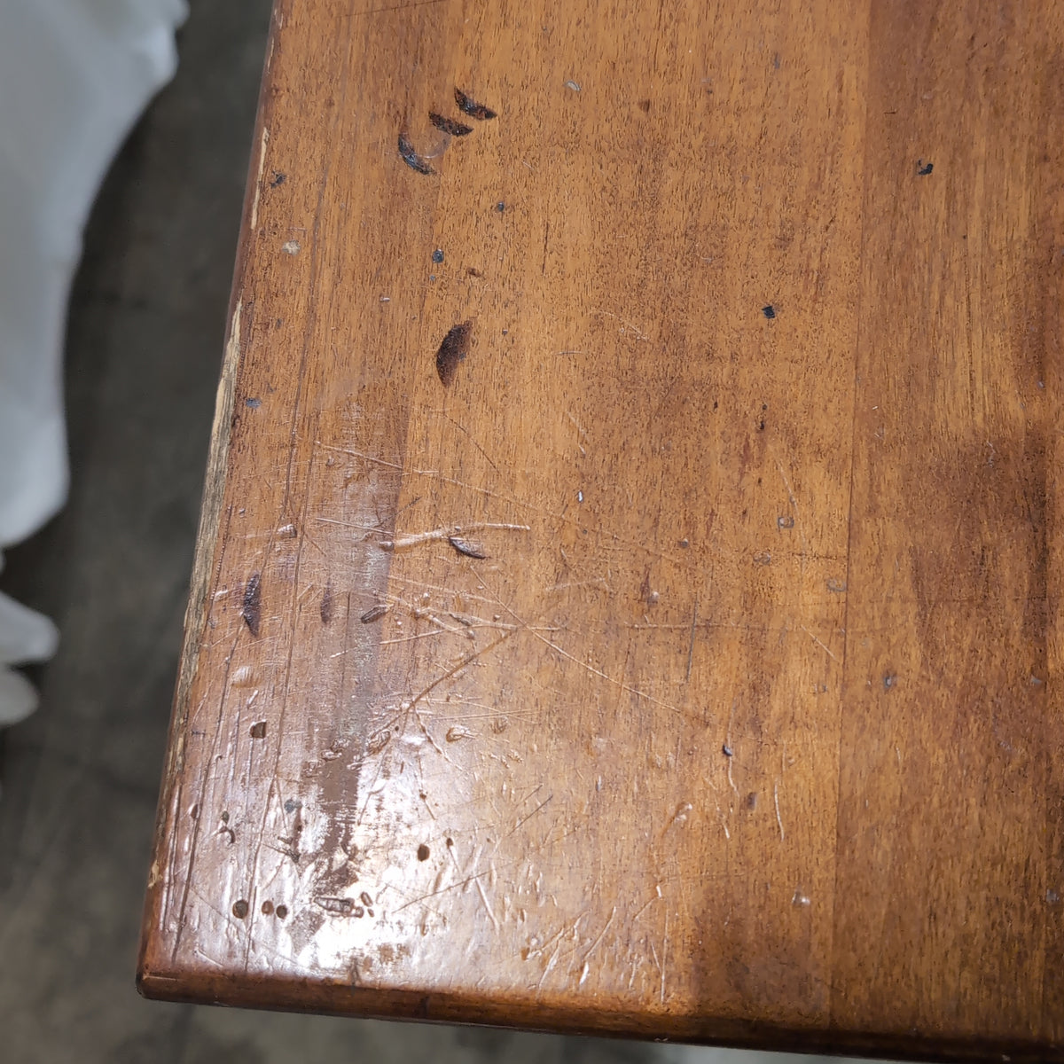 Brown Wood Four-Drawer Desk with Round Knobs