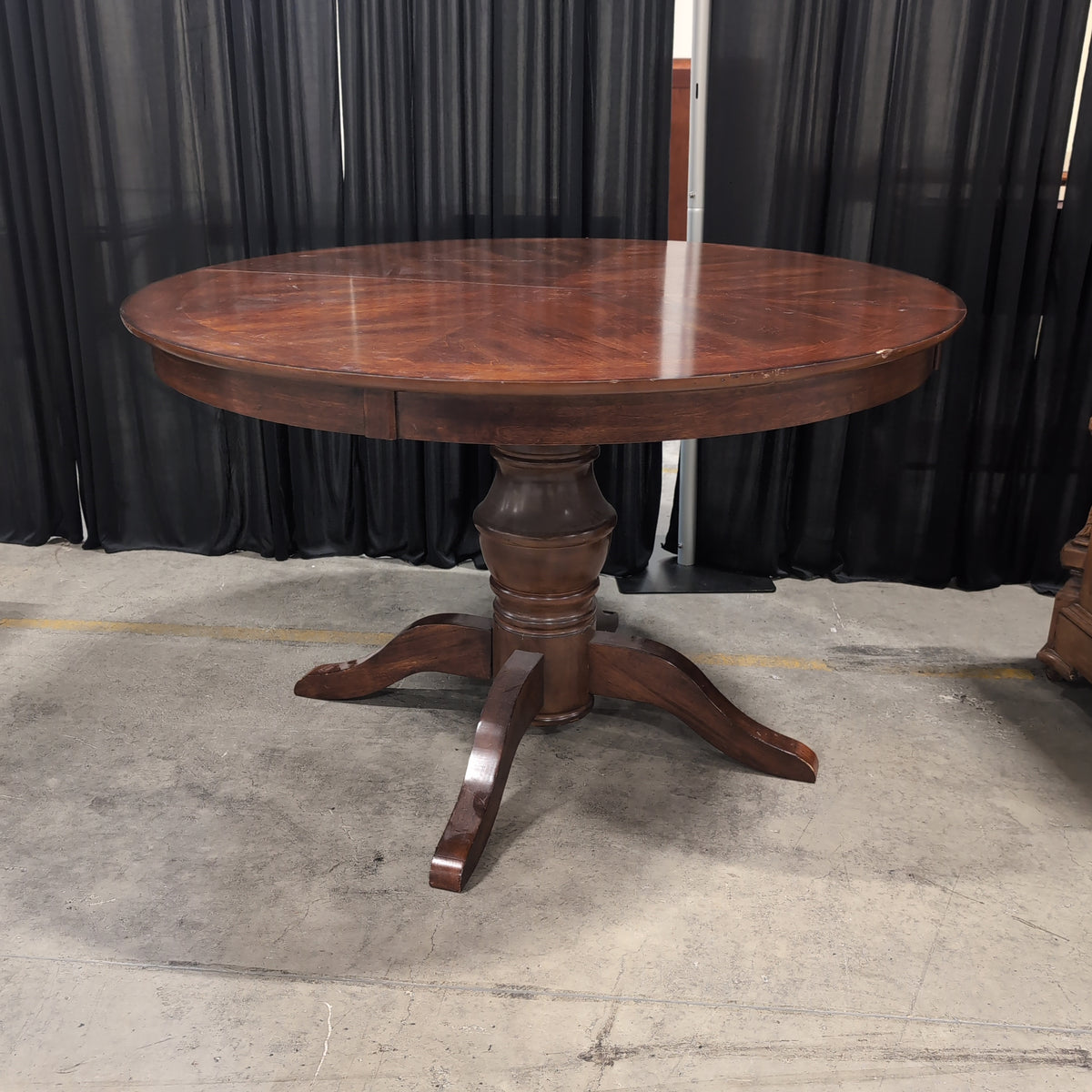 Round Dark Wood Dining Table with Pedestal Base