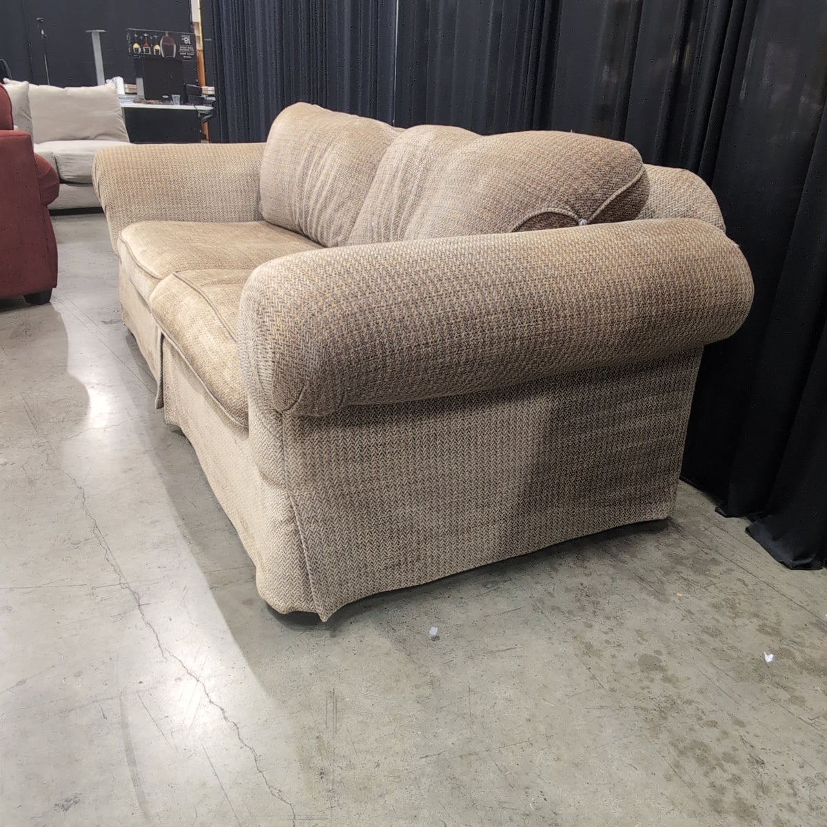 Tan Herringbone Upholstered Rolled Arm Couch with Skirted Base