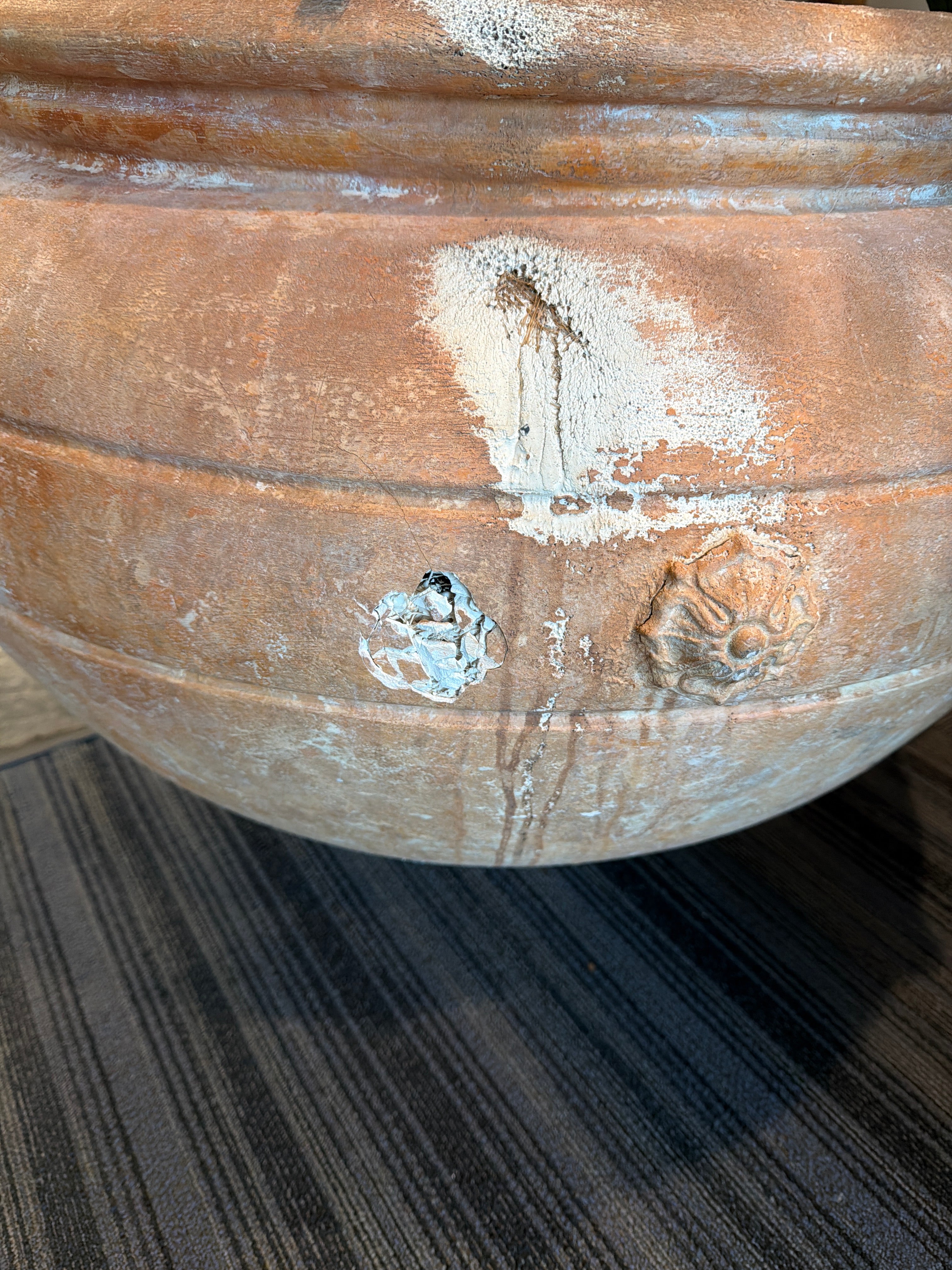 Ornate Terracotta-Style Planter with Lion Head Accents