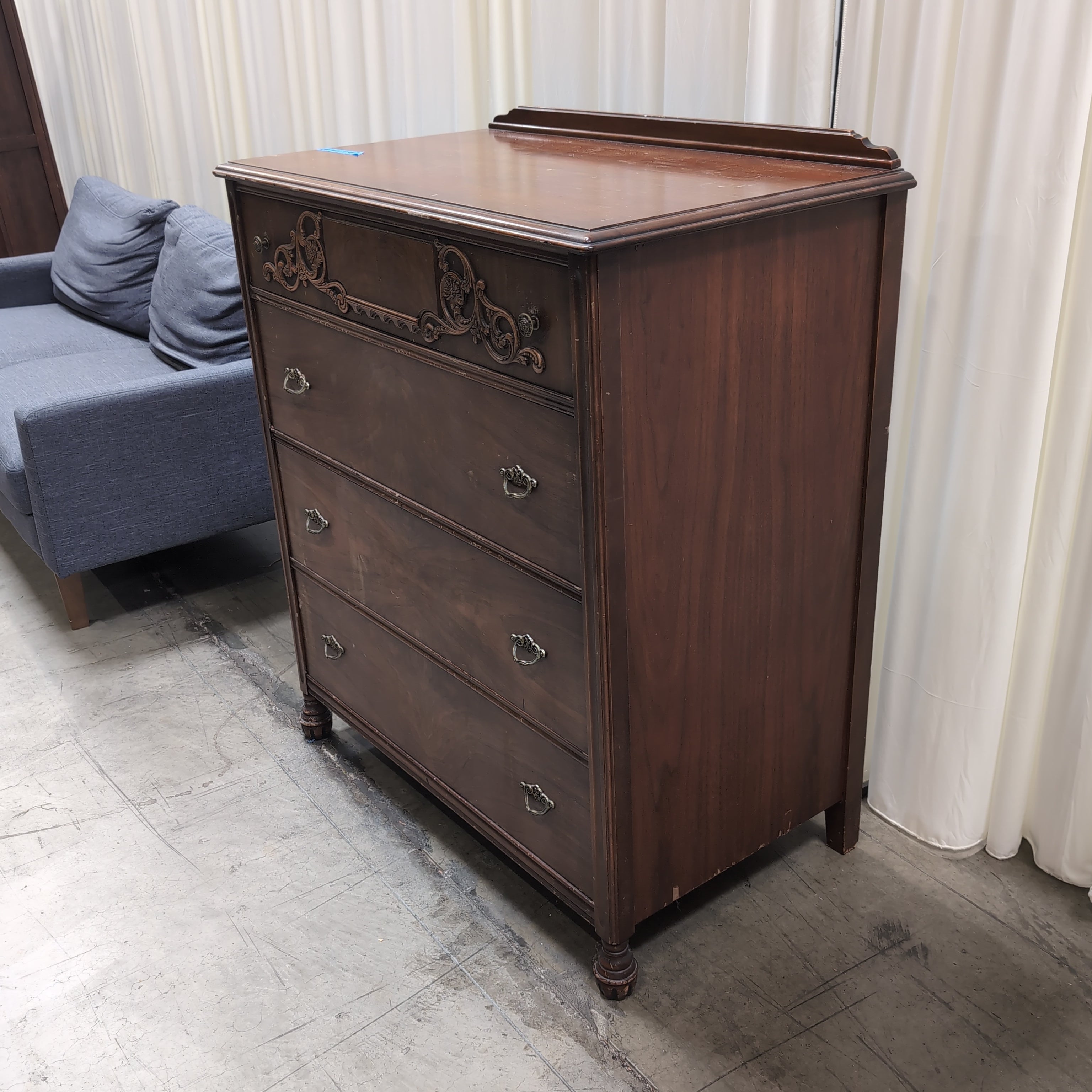 Vintage Dark Wood Four-Drawer Dresser with Ornate Carving