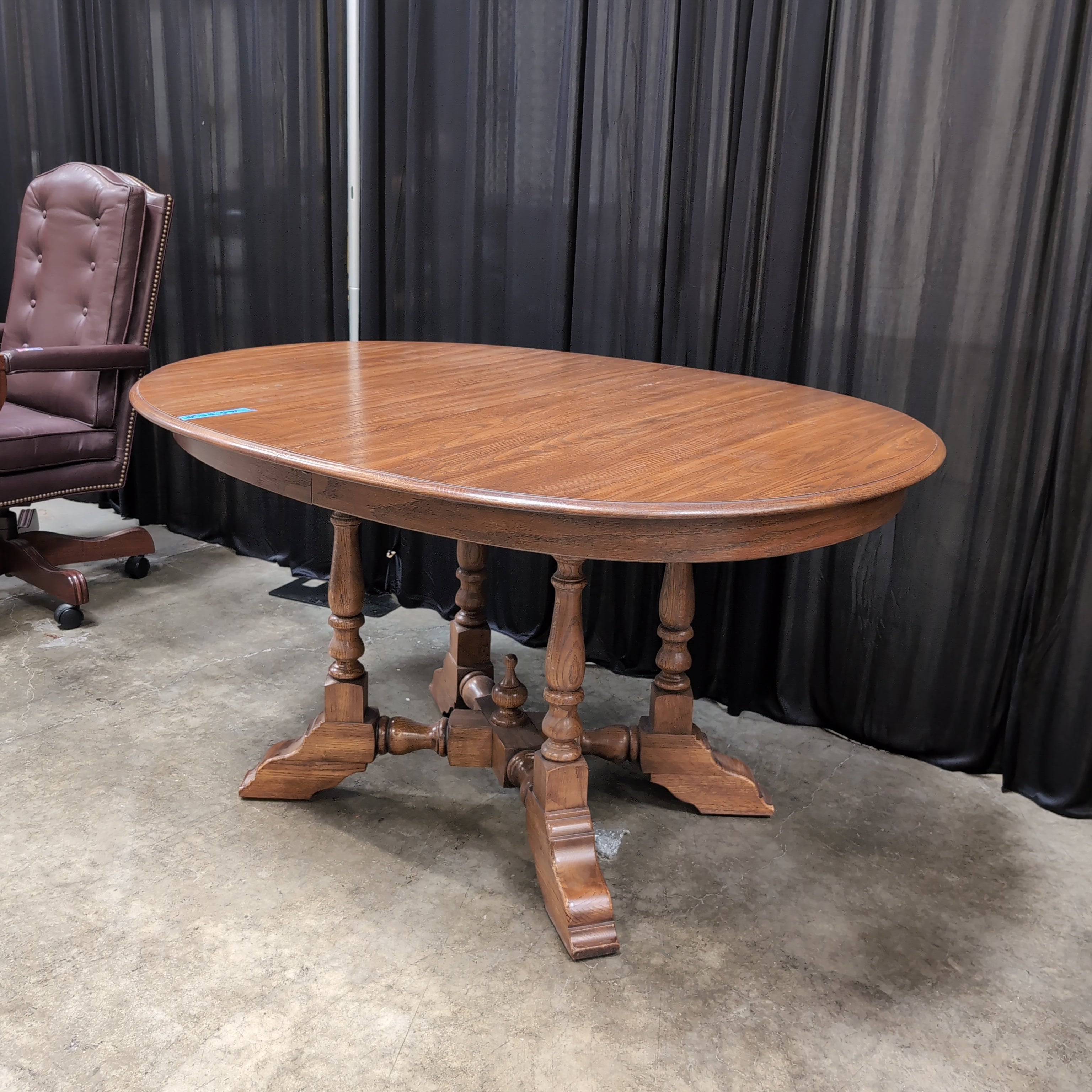 Round Brown Wood Dining Table with Drop Leaves