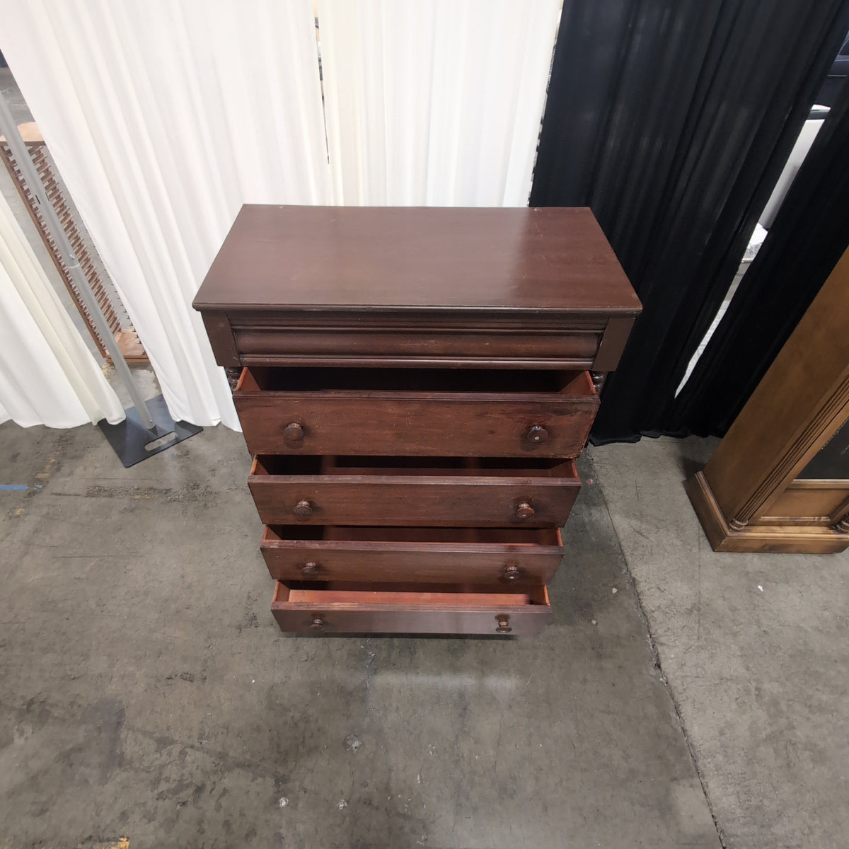 Dark Wood Four-Drawer Dresser with Turned Columns