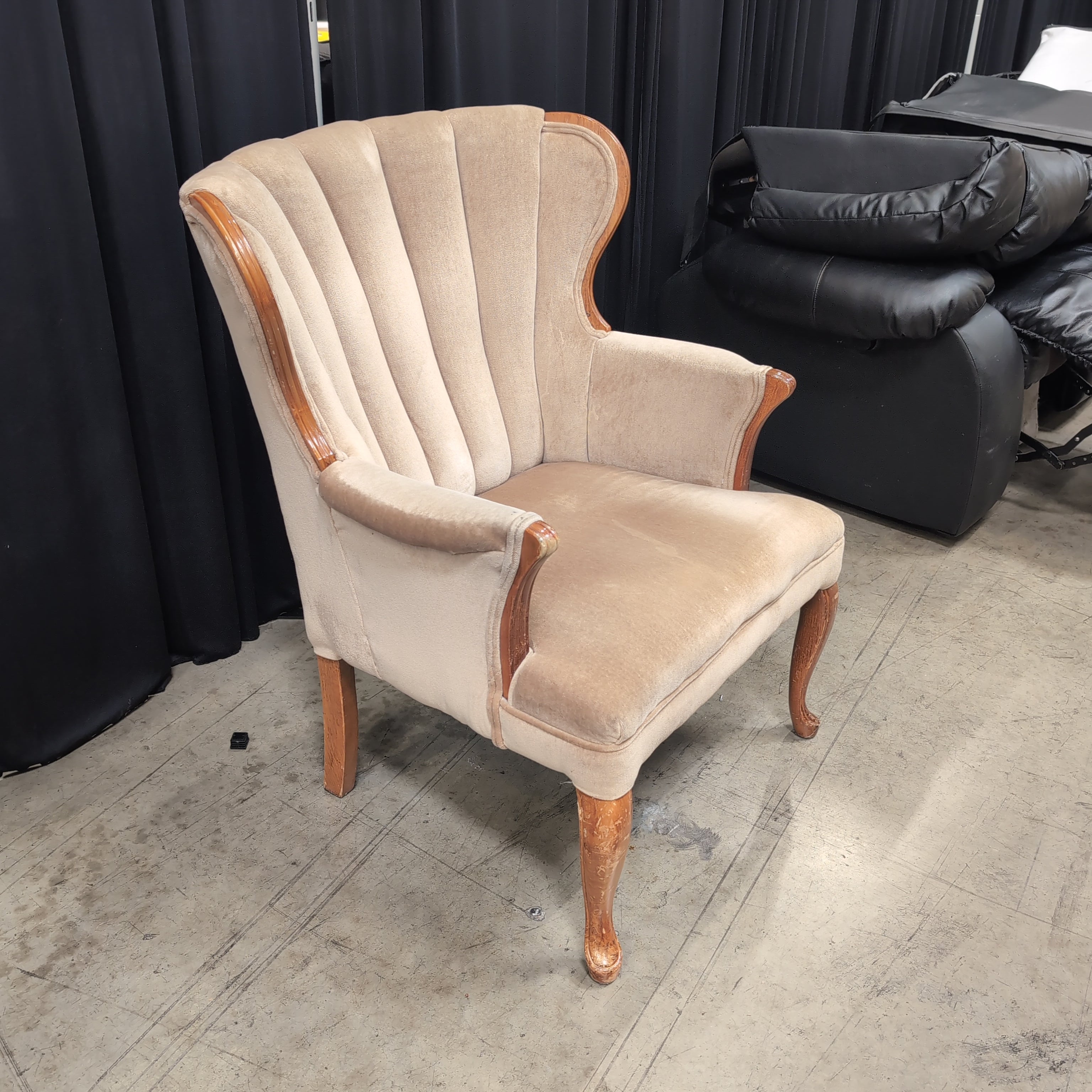 Tan Upholstered Shell Back Armchair with Carved Wood