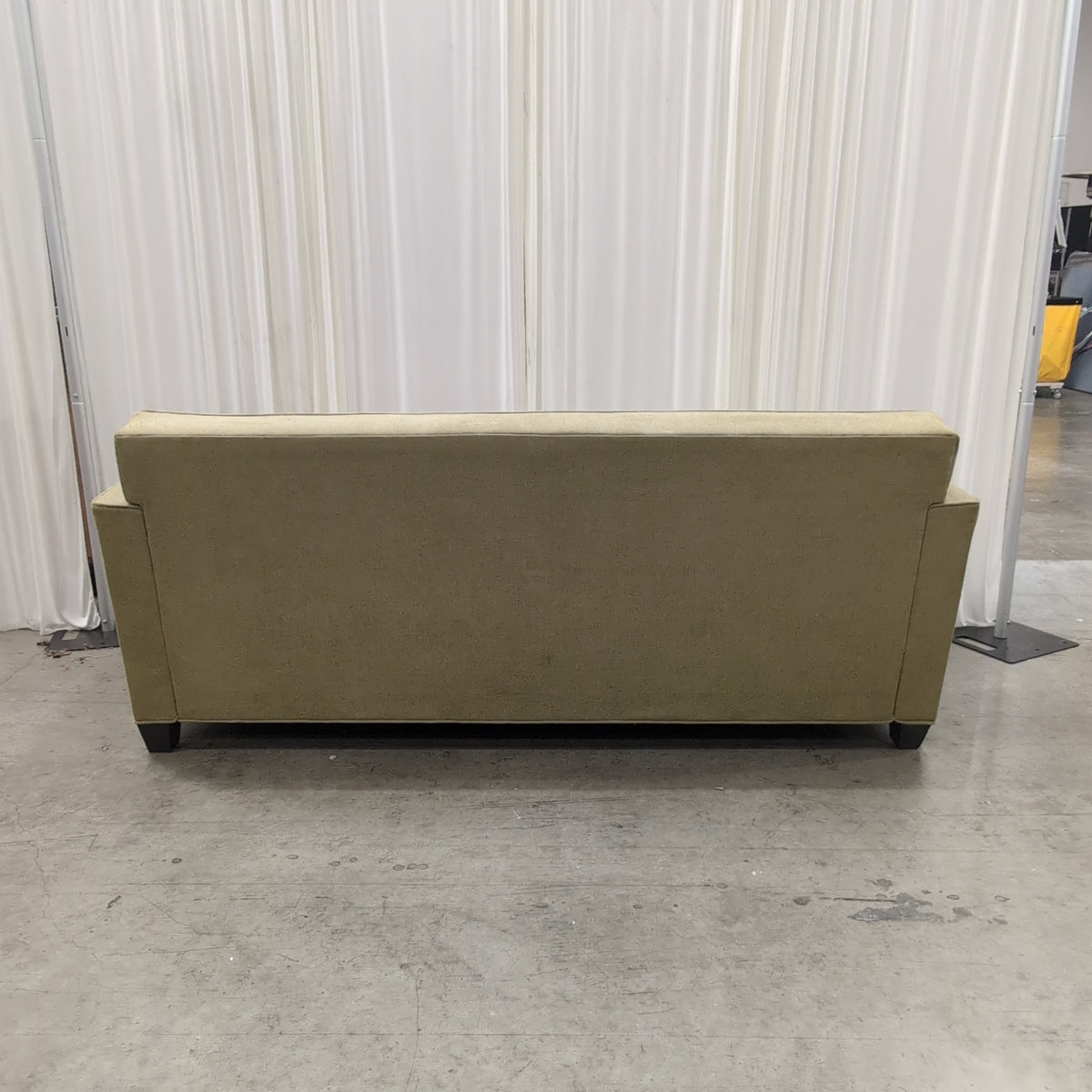 Tan Fabric Three-Cushion Couch with Rolled Arms
