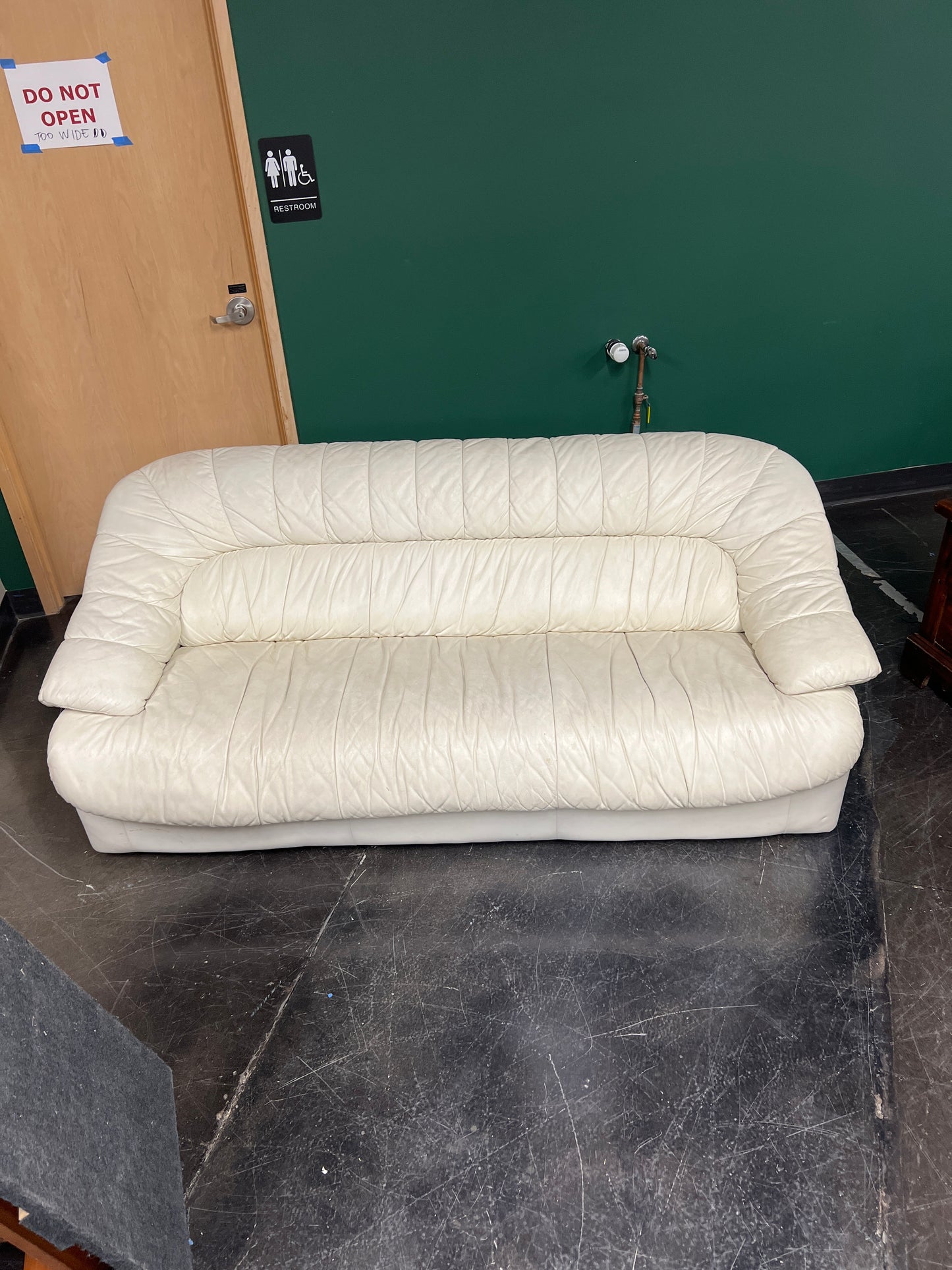 Cream-Colored Leather Sofa with Unique Design