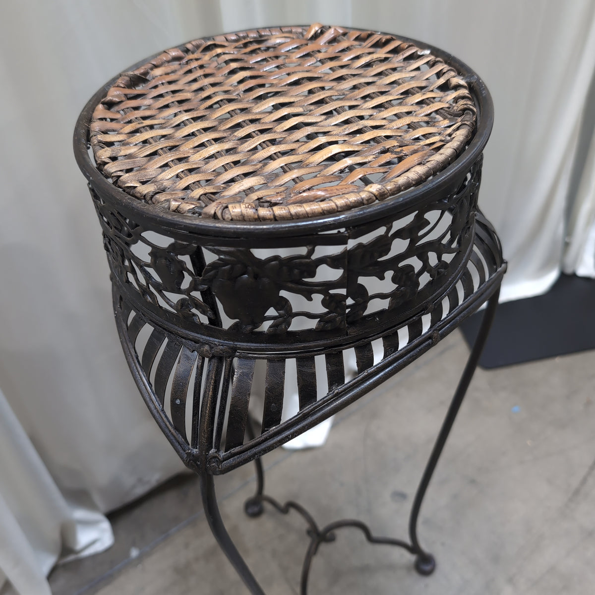 Ornate Dark Metal Plant Stand with Woven Top