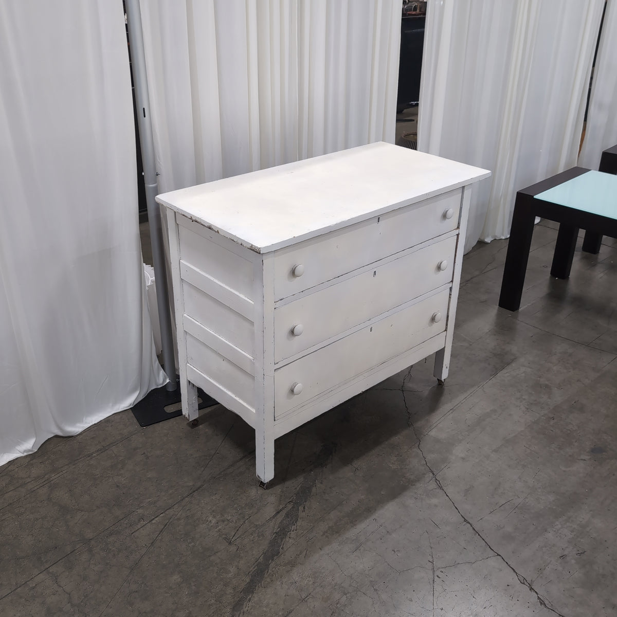 White Wood Three-Drawer Dresser with Round Knobs