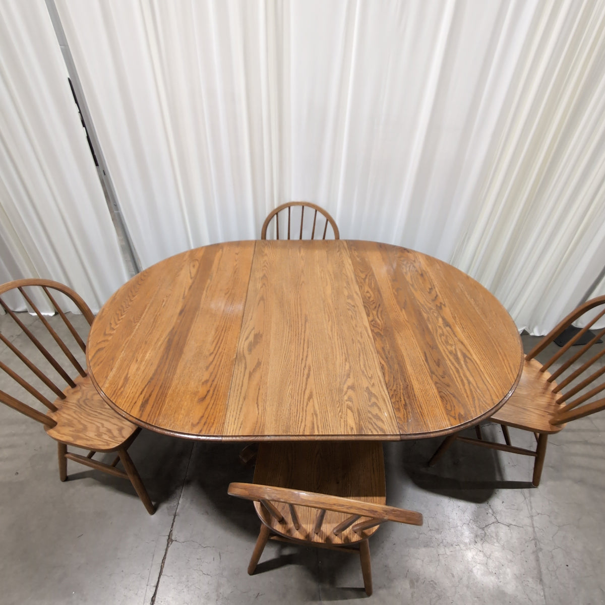 Oval Pedestal Wood Dining Table with Windsor Chairs