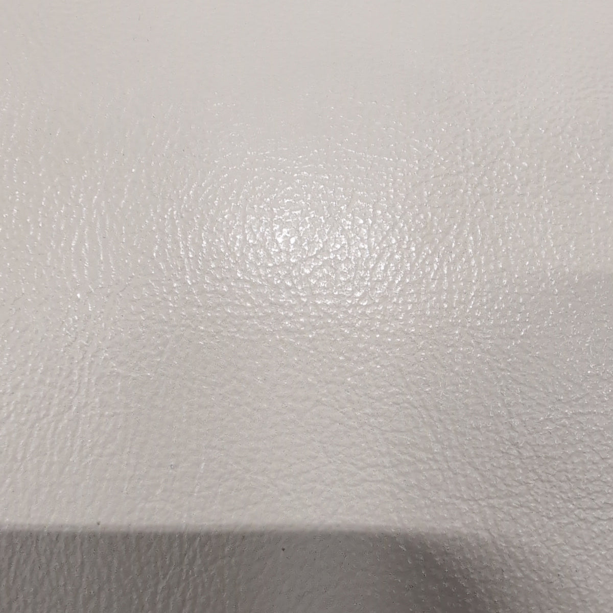Cream-Colored Three-Seat Padded Couch