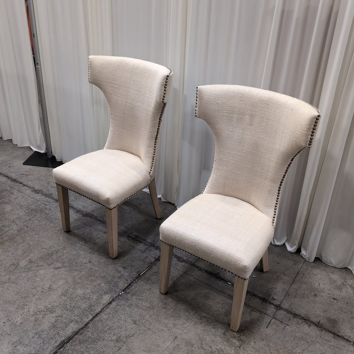 Light Beige Upholstered High-Back Chair with Nailhead Trim
