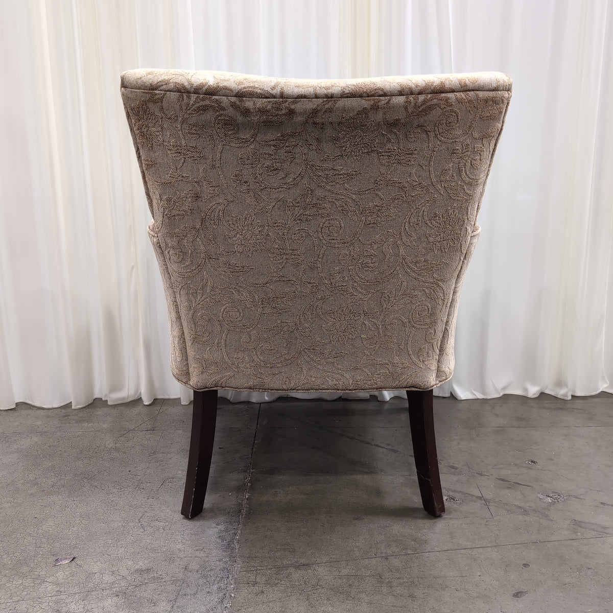 Beige Damask Upholstered Wingback Armchair with Dark Wood Legs