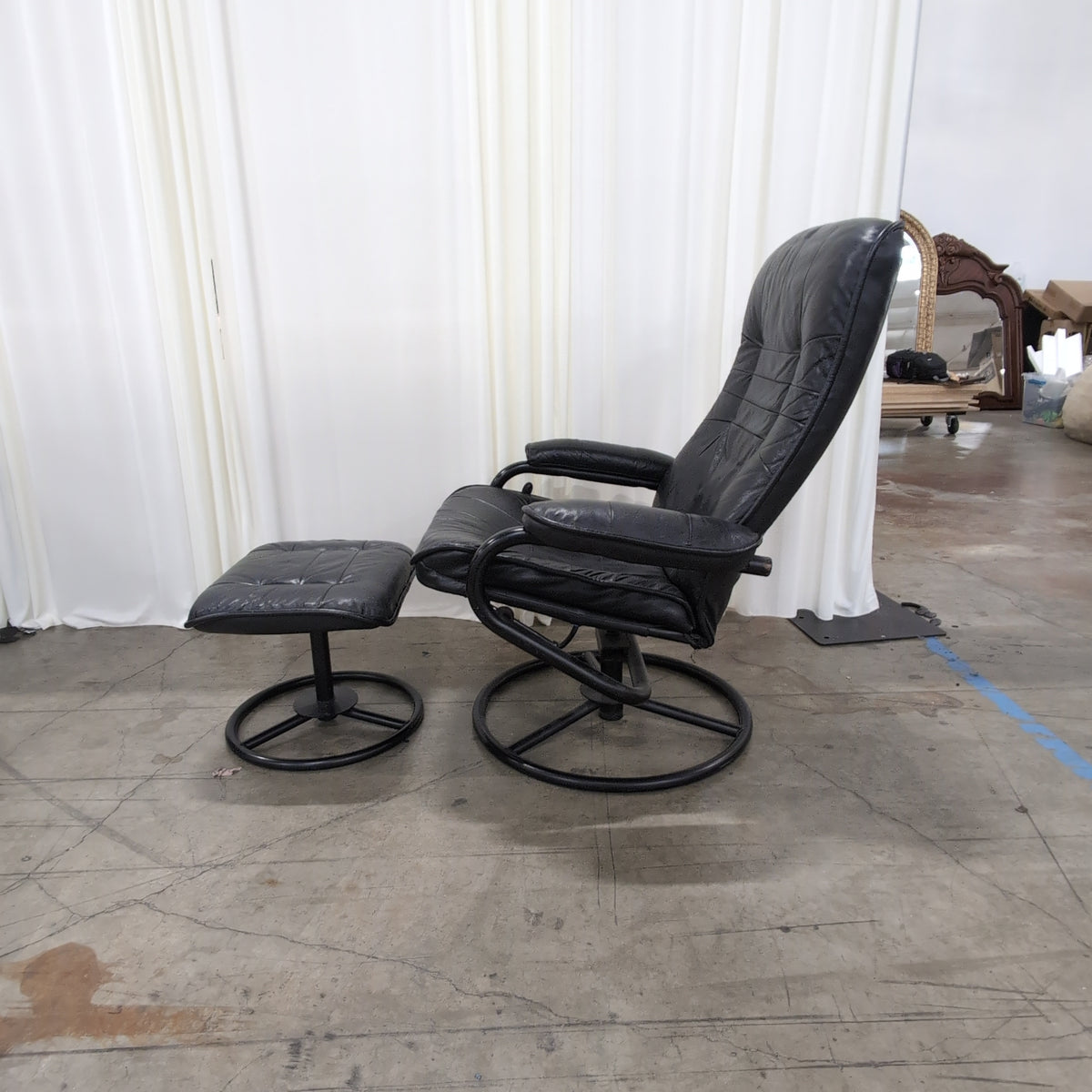 Black Tufted Leather Swivel Recliner with Ottoman