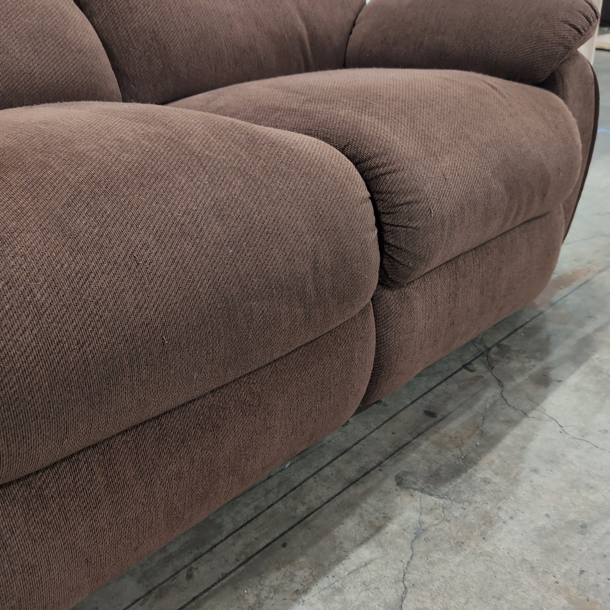 Brown Textured Fabric Reclining Loveseat with Padded Arms