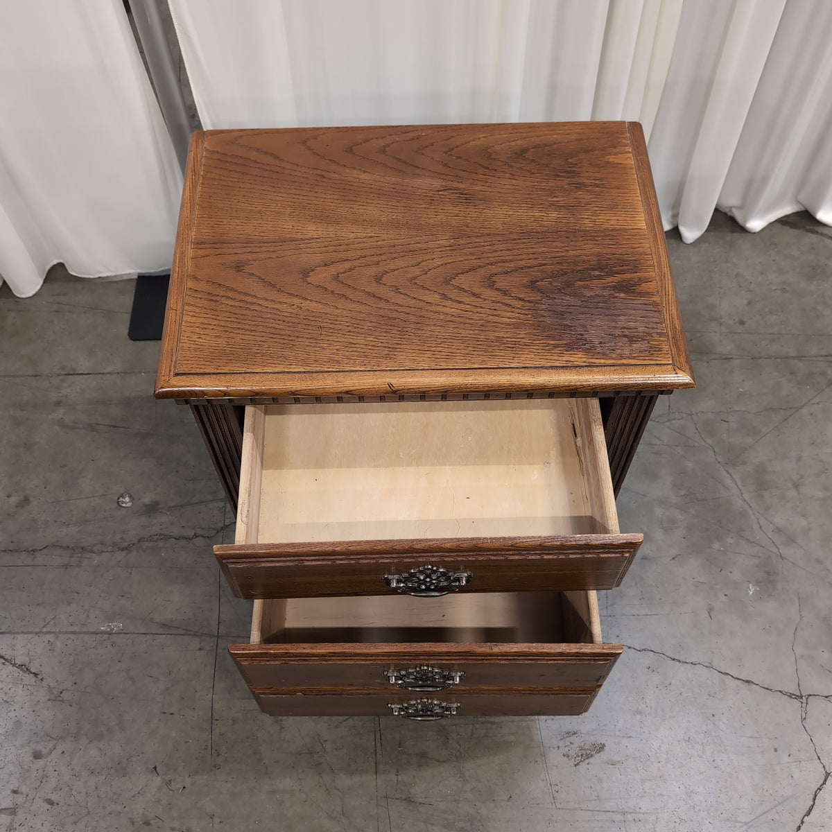 Traditional Brown Wood Three-Drawer Nightstand with Ornate Hardware