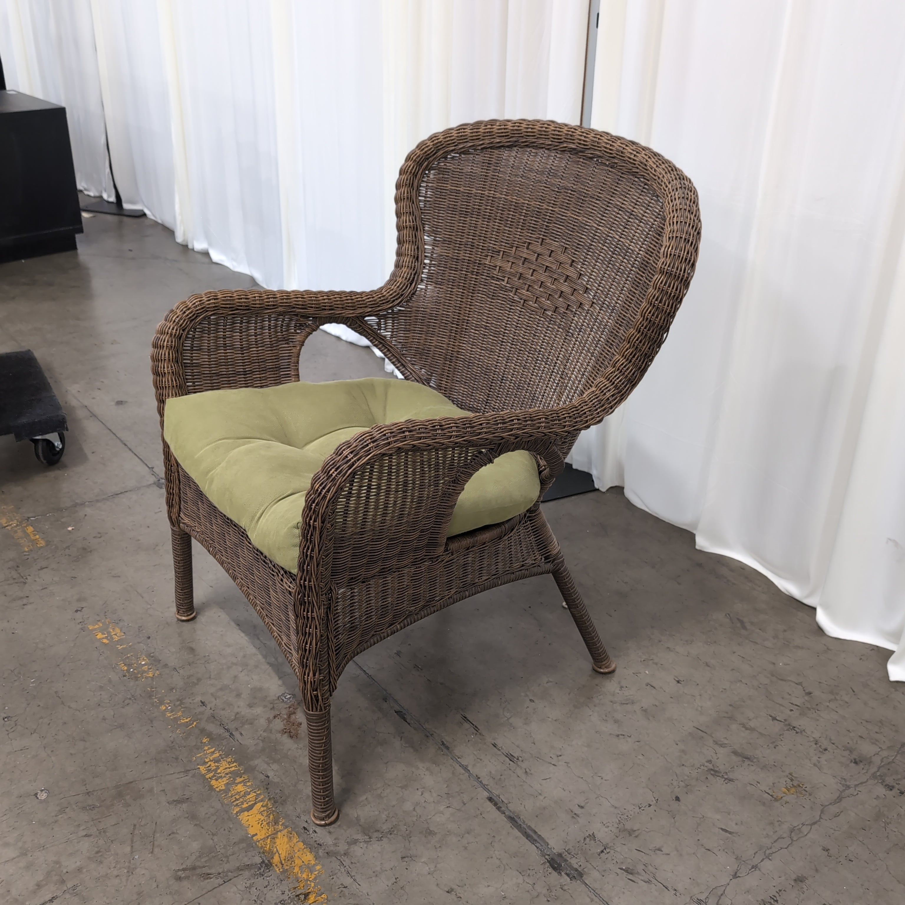 Brown Wicker Accent Chair with Green Cushion
