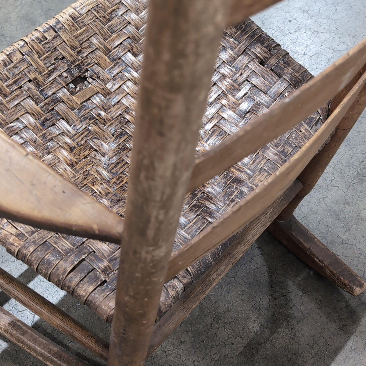 Brown Ladder-Back Rocking Chair with Woven Seat