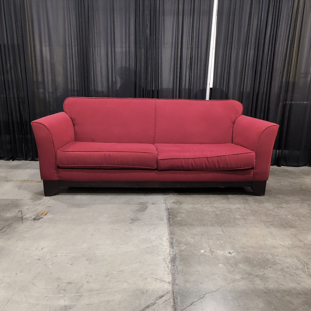 Red Fabric Upholstered Two-Cushion Couch
