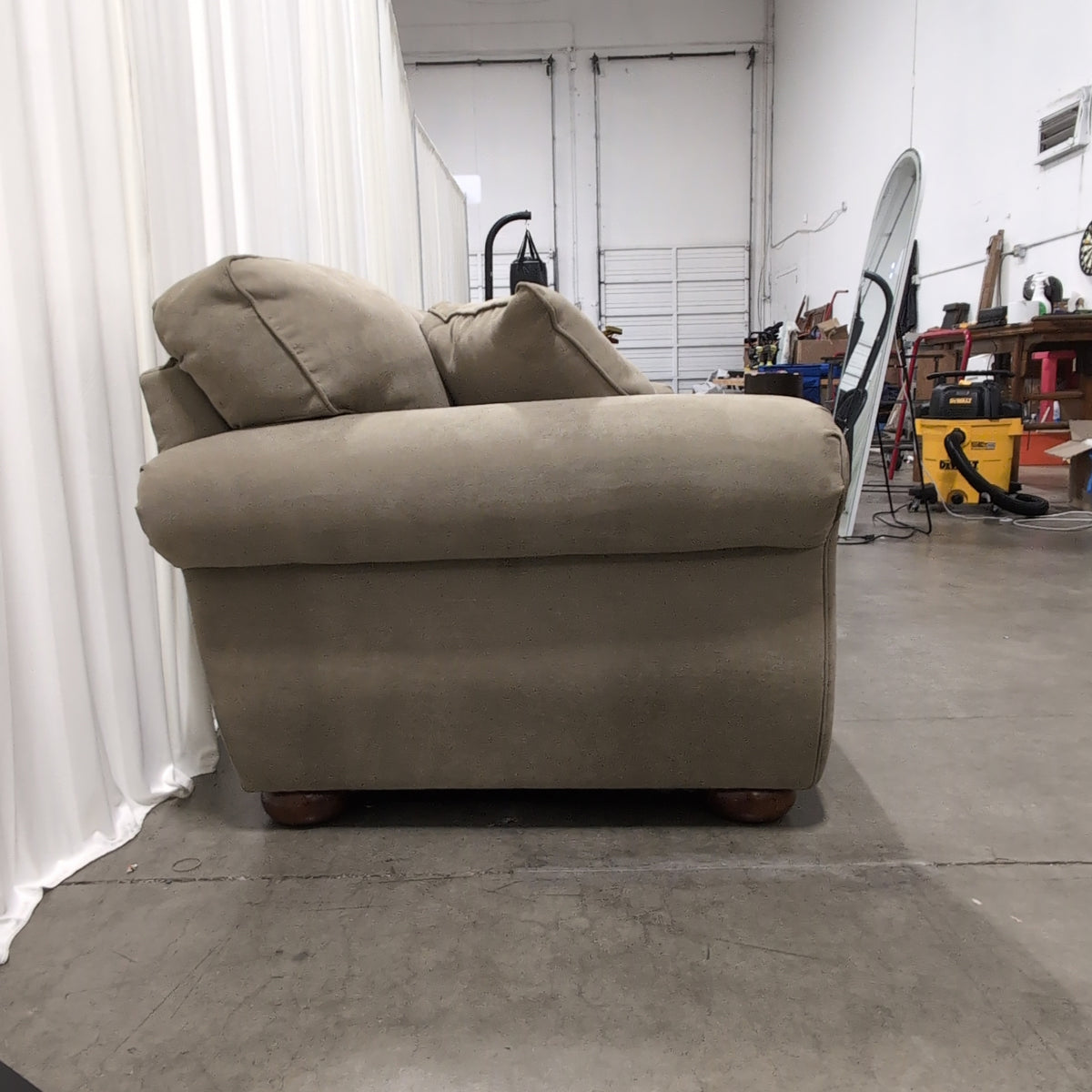 Beige Upholstered Three-Seat Couch with Rolled Arms