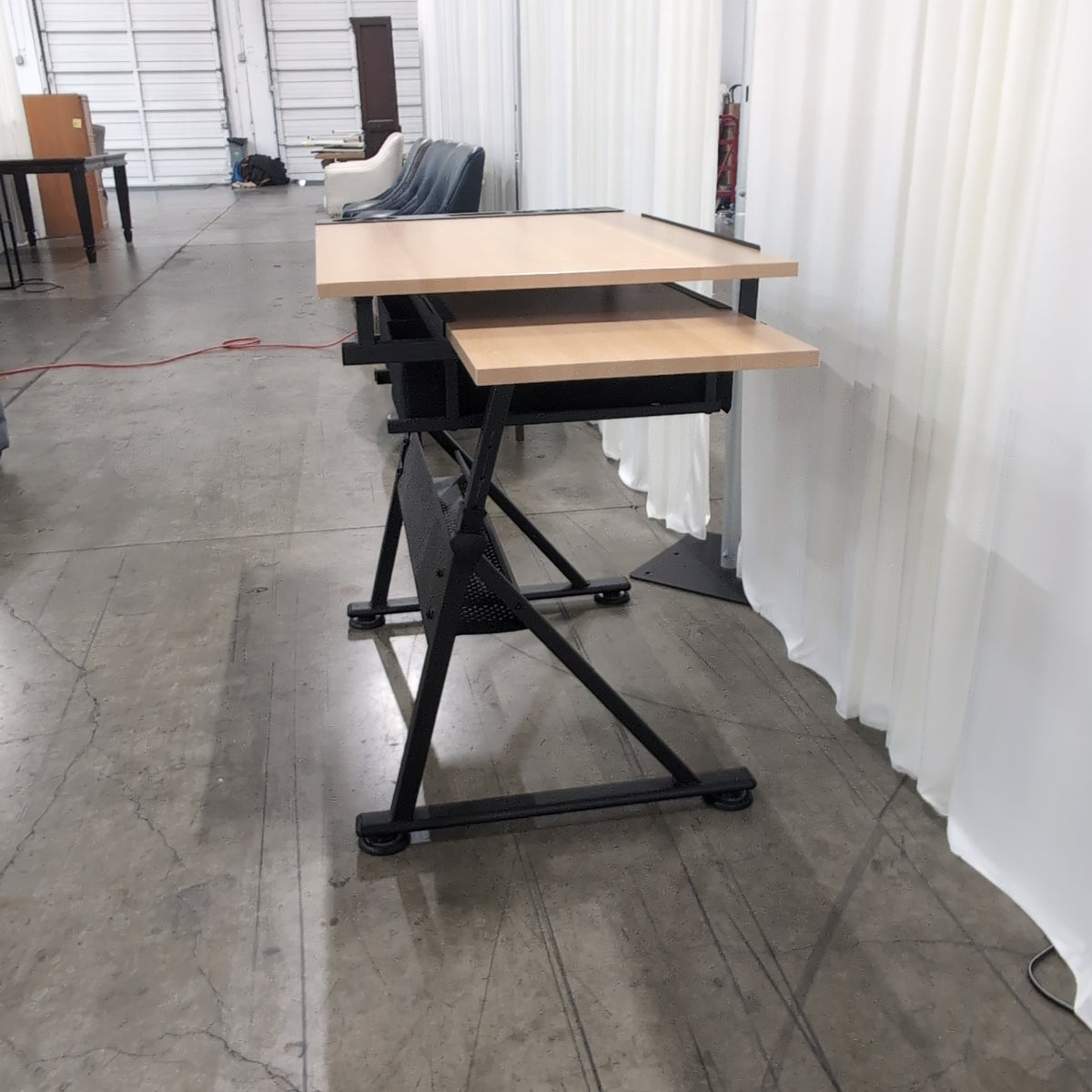Adjustable Light Wood-Tone Drafting Desk with perforated shelf