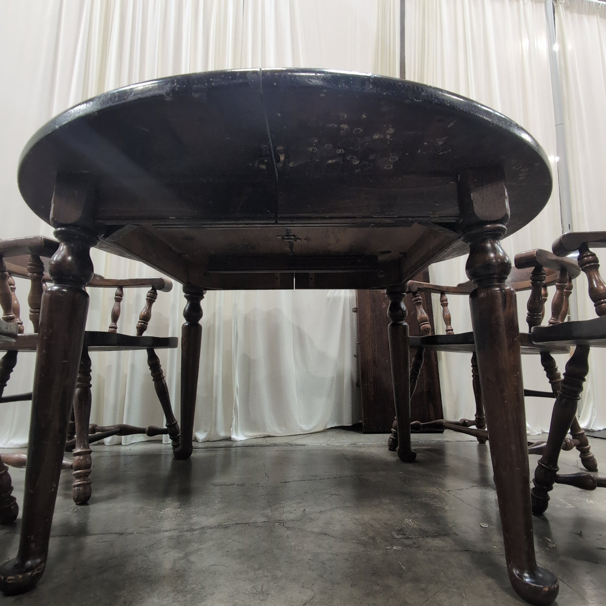 Dark Wood Round Dining Table with Spindle Chairs