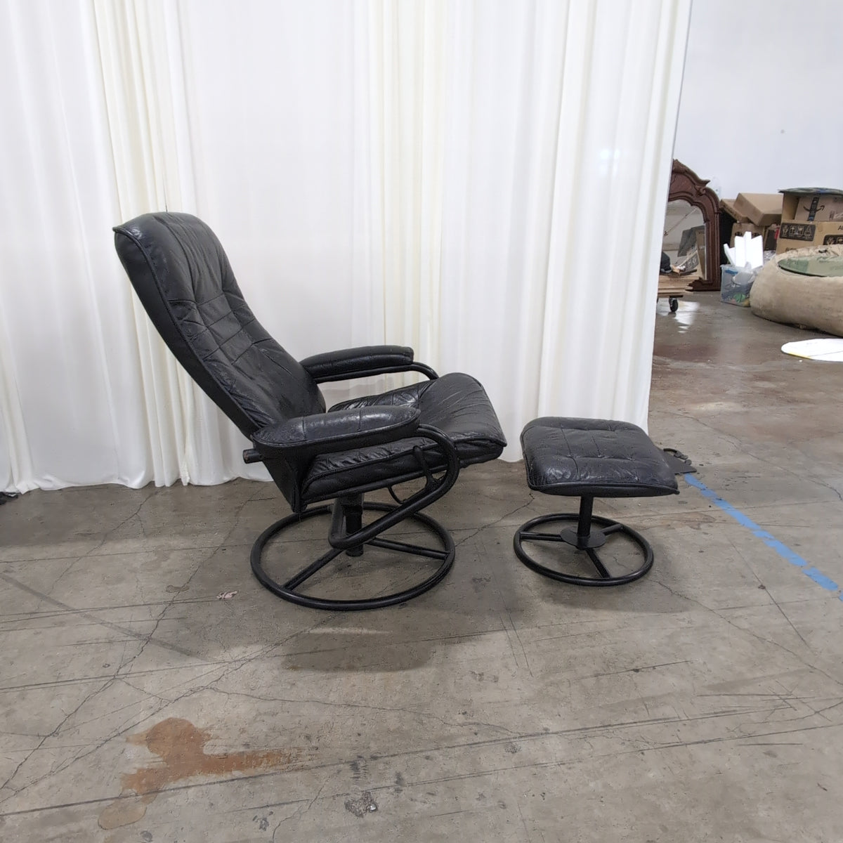 Black Tufted Leather Swivel Recliner with Ottoman