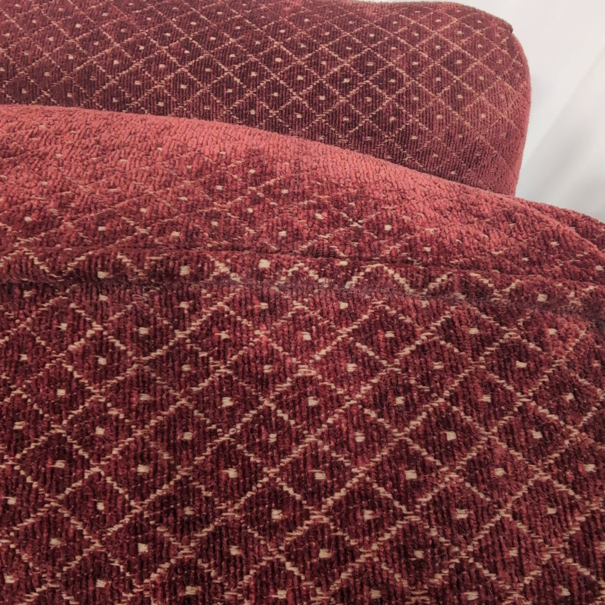 Deep Red Upholstered Three-Seat Couch