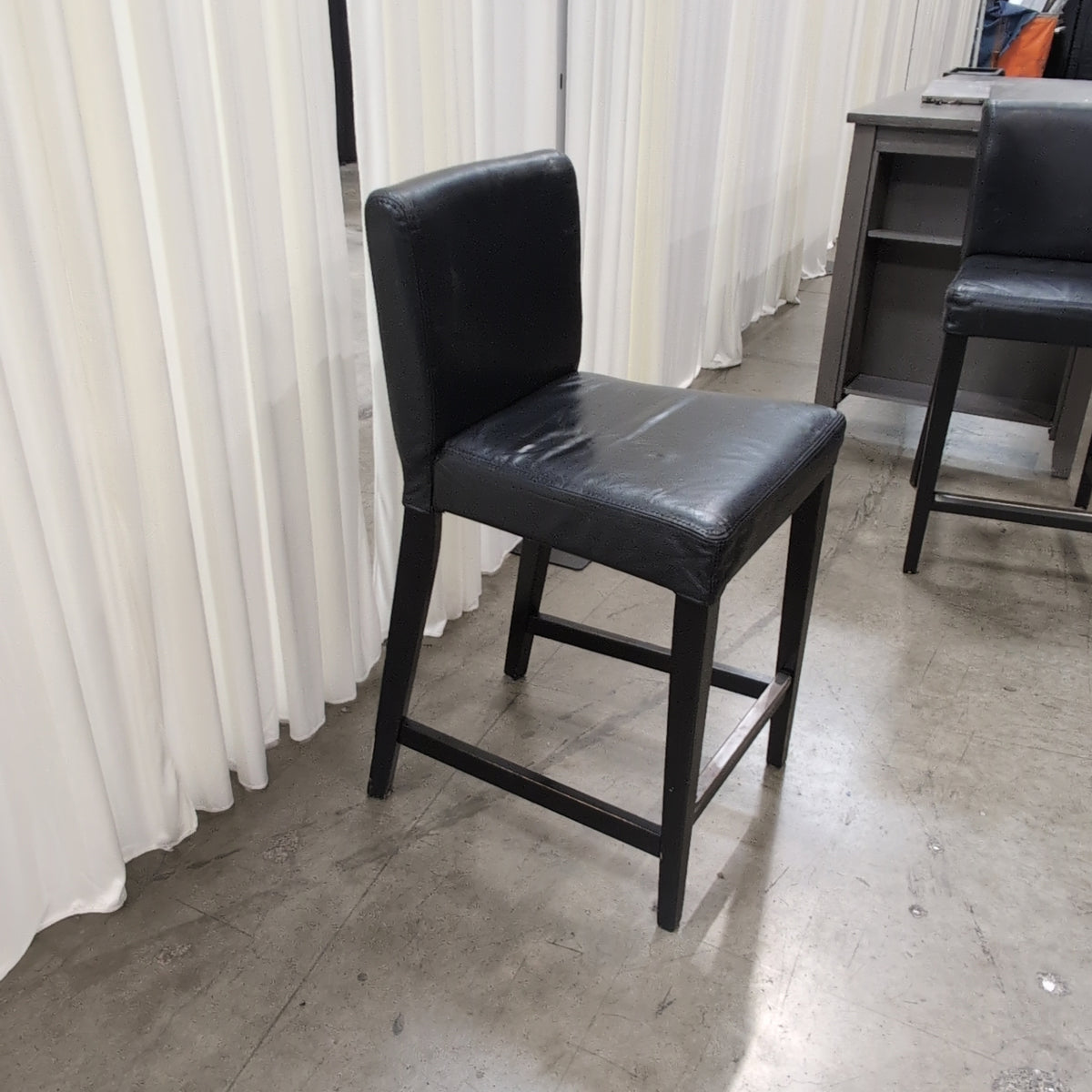 IKEA Brand Modern Black Faux Leather Bar Stool with Metal Footrest