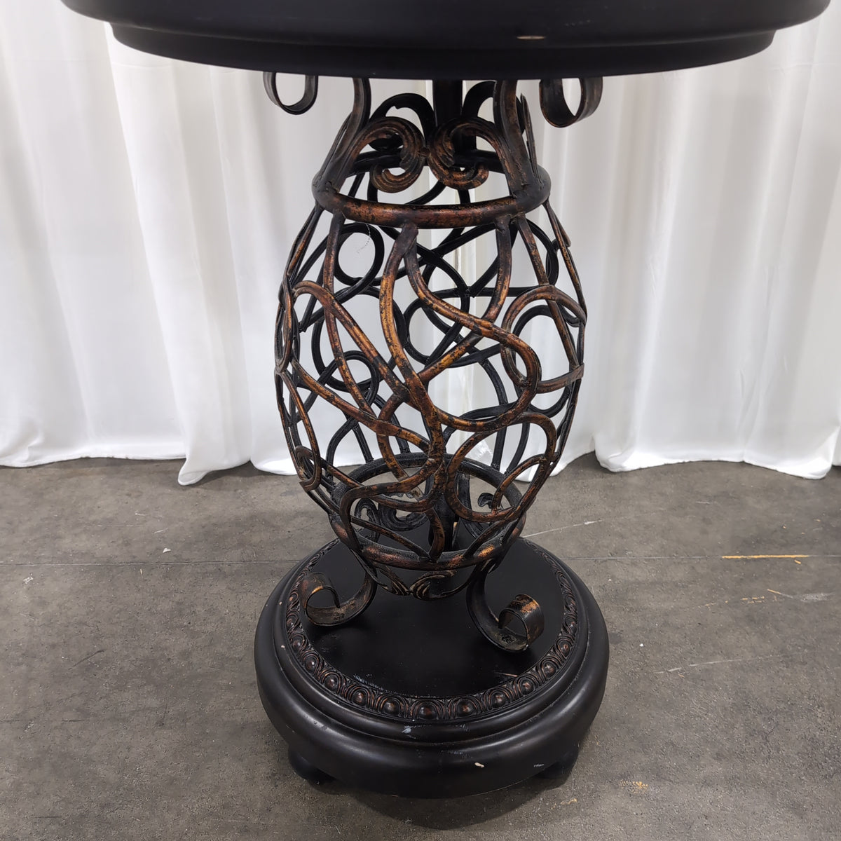 Round Dark Wood End Table with Ornate Metal Base